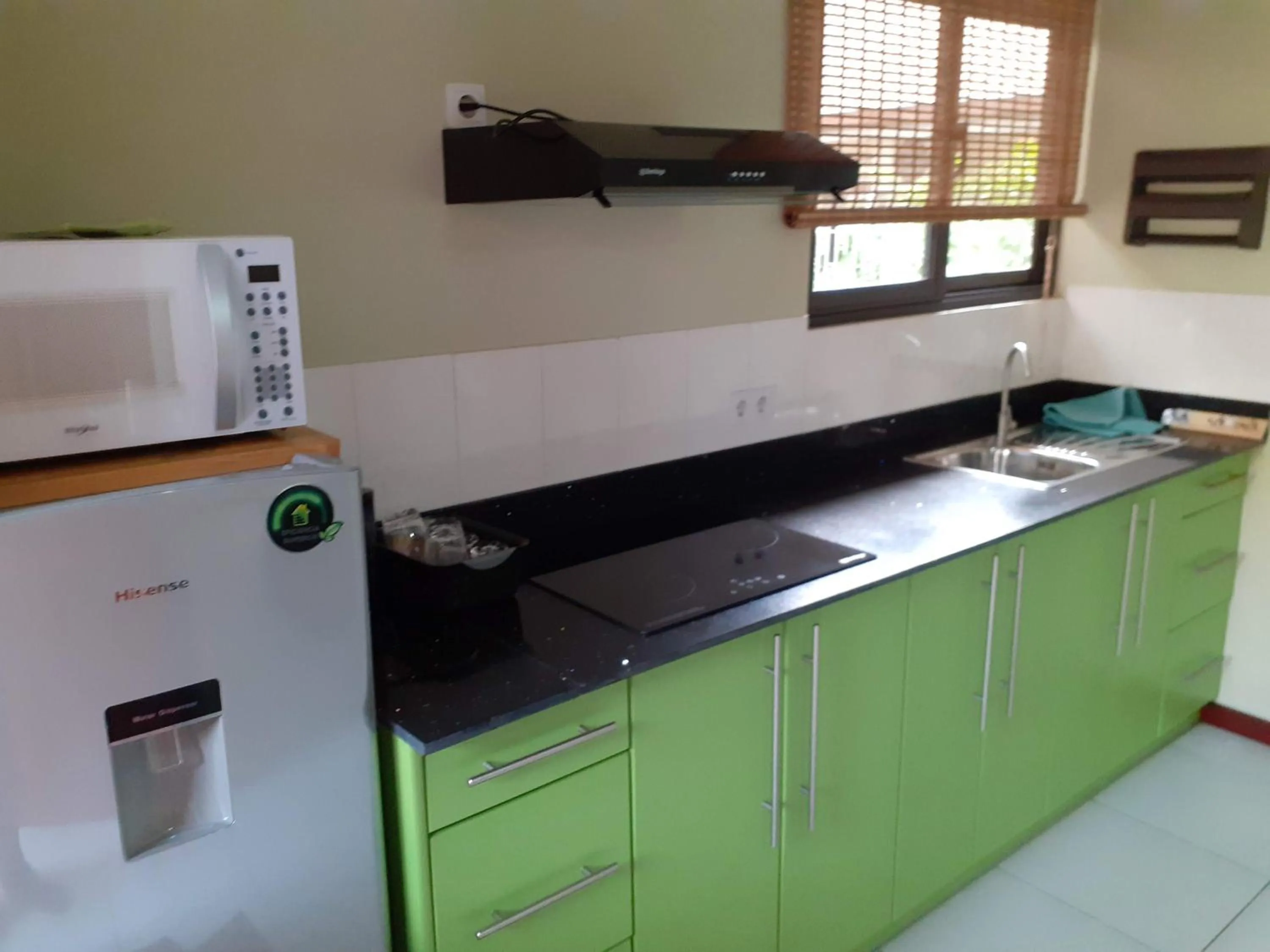 Kitchen or kitchenette in Max Garden and Pool