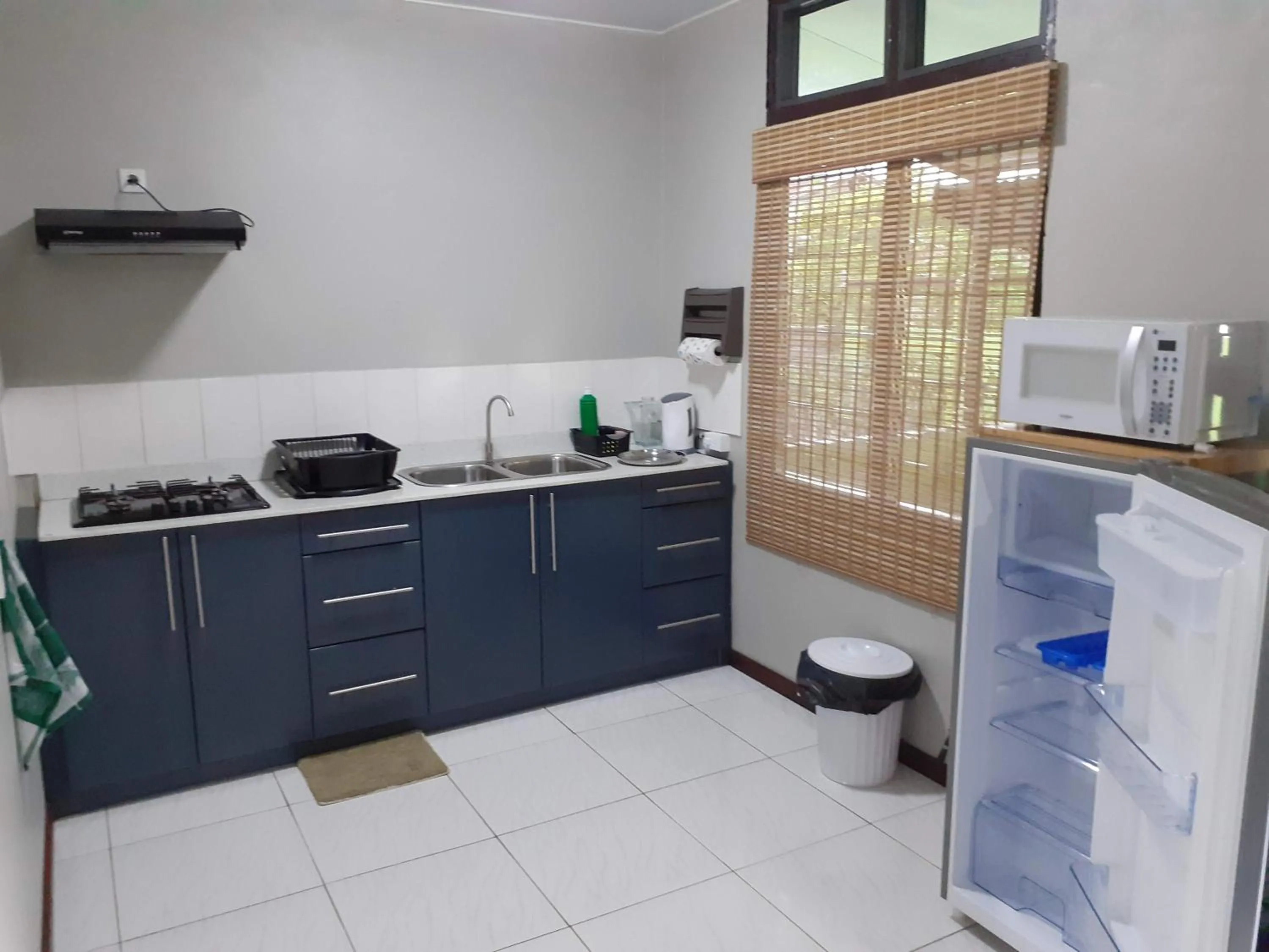 Kitchen or kitchenette in Max Garden and Pool