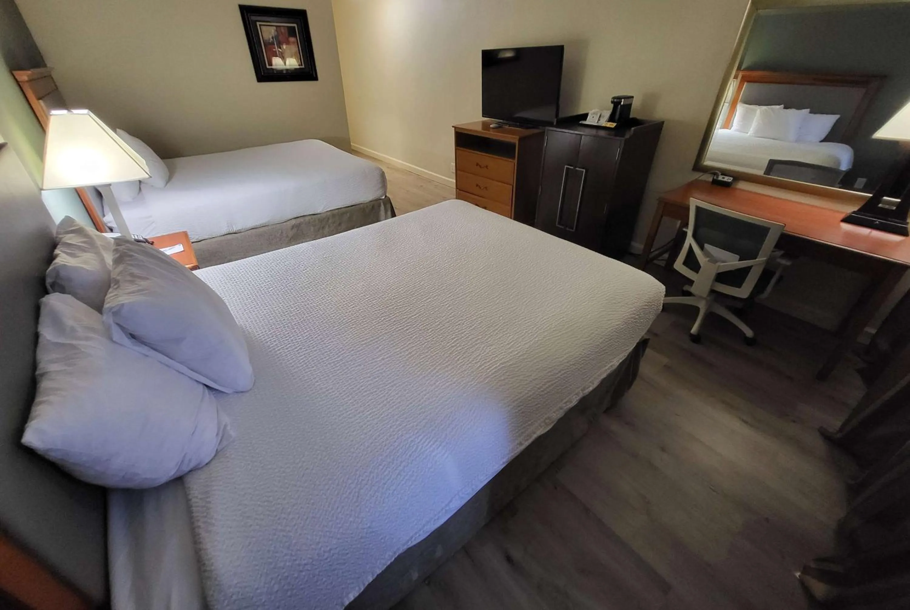 Photo of the whole room, Bed in Ramada by Wyndham Houston Intercontinental Airport East