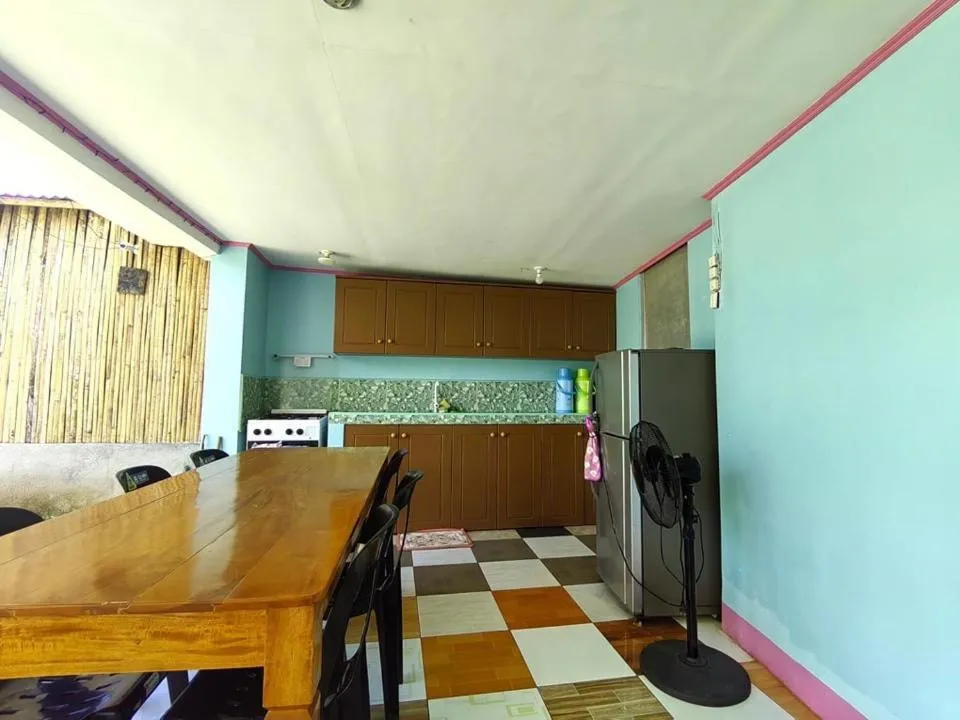 Kitchen or kitchenette in Alona J&J Tourist Inn