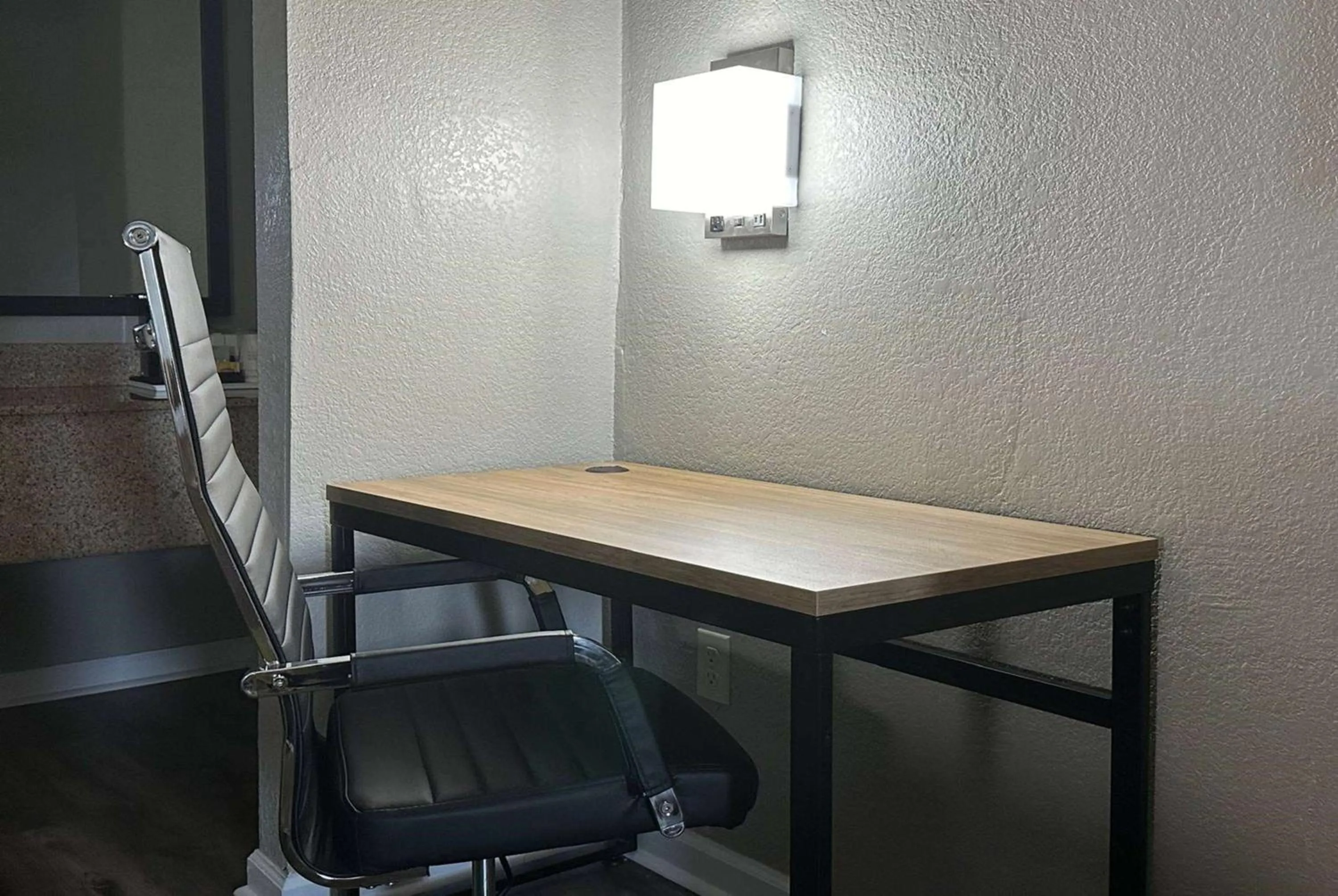 Seating area in Super 8 by Wyndham Monroe