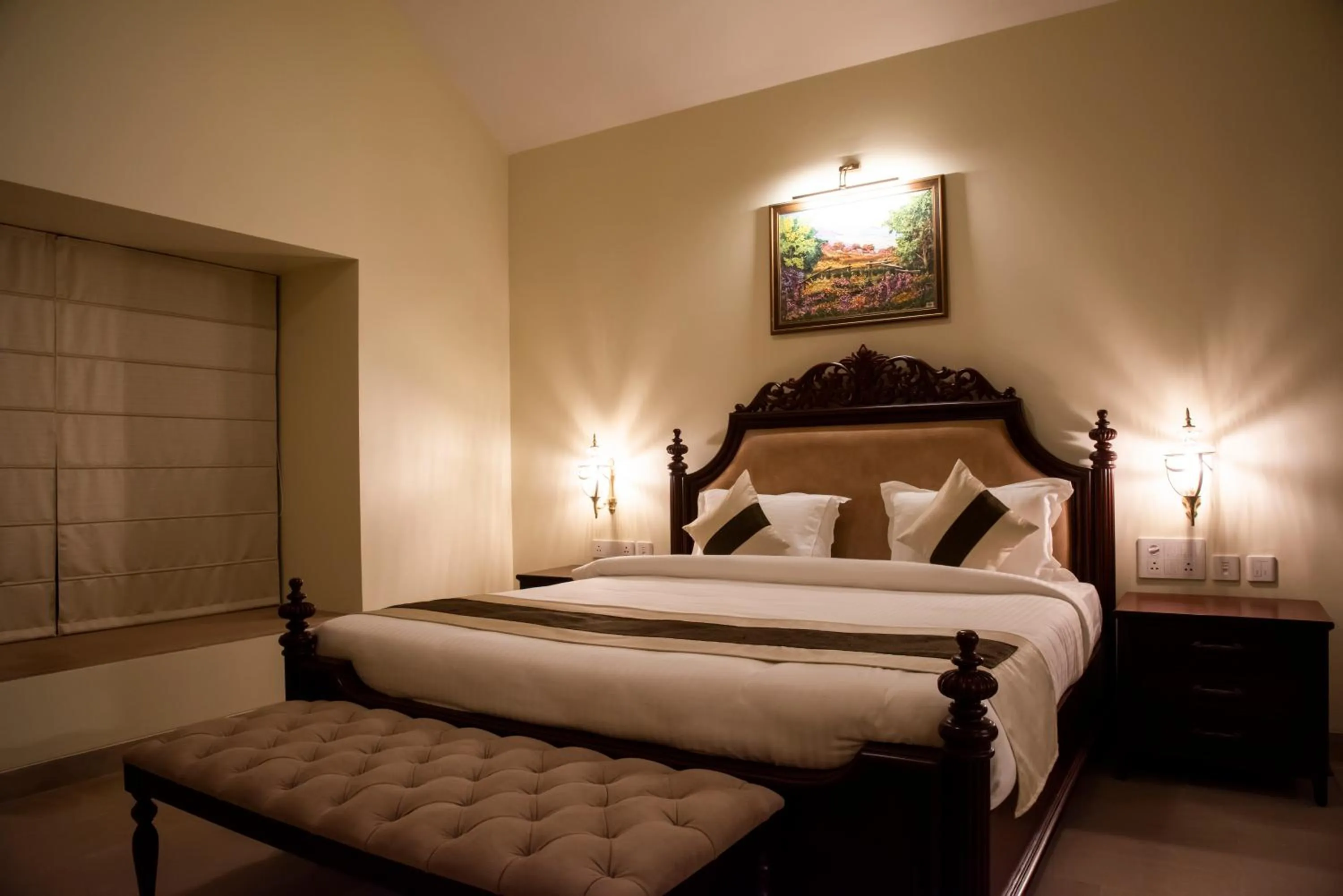 Bed in WelcomHeritage Tadoba Vanya Villas Resort & Spa