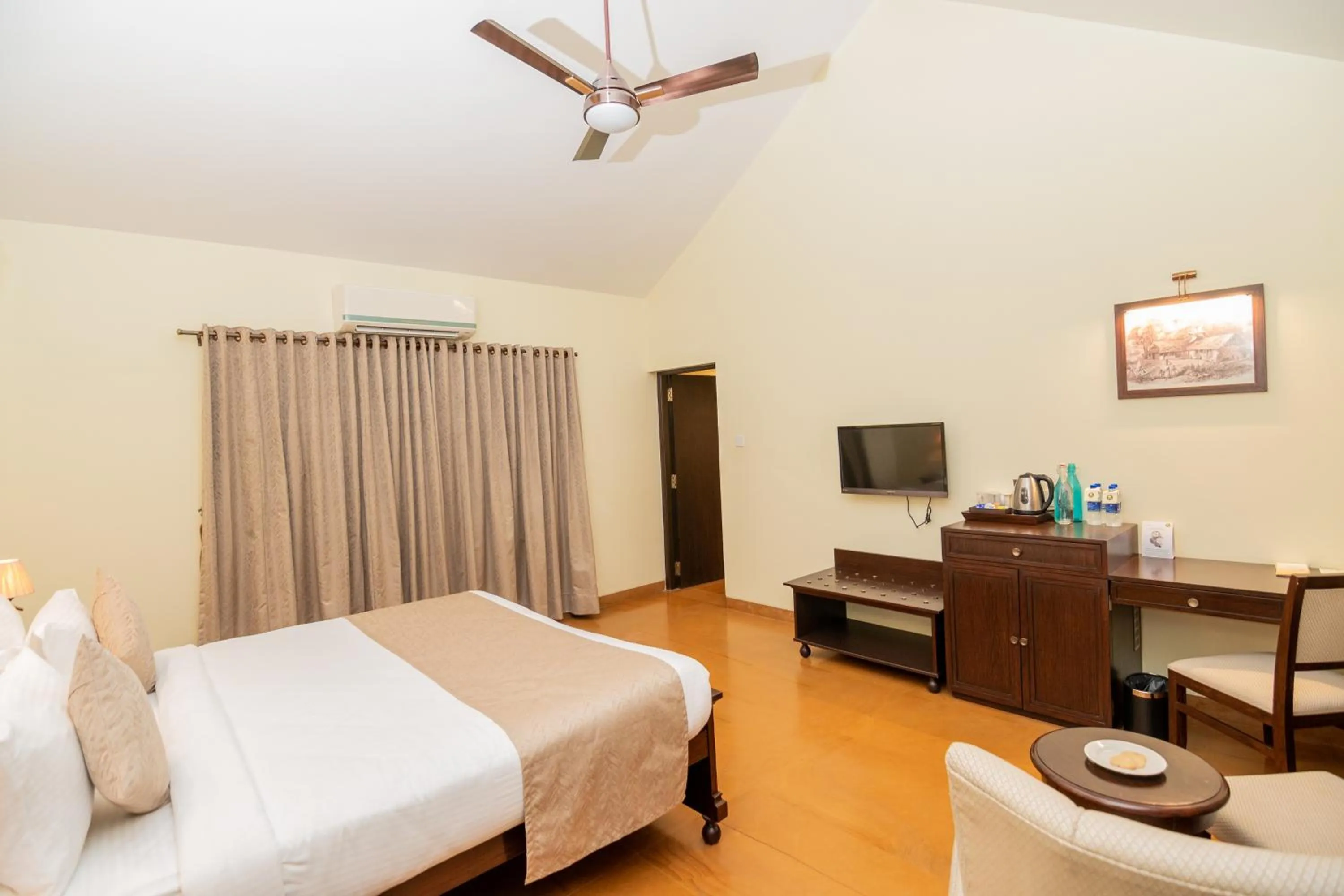 Bed in WelcomHeritage Tadoba Vanya Villas Resort & Spa