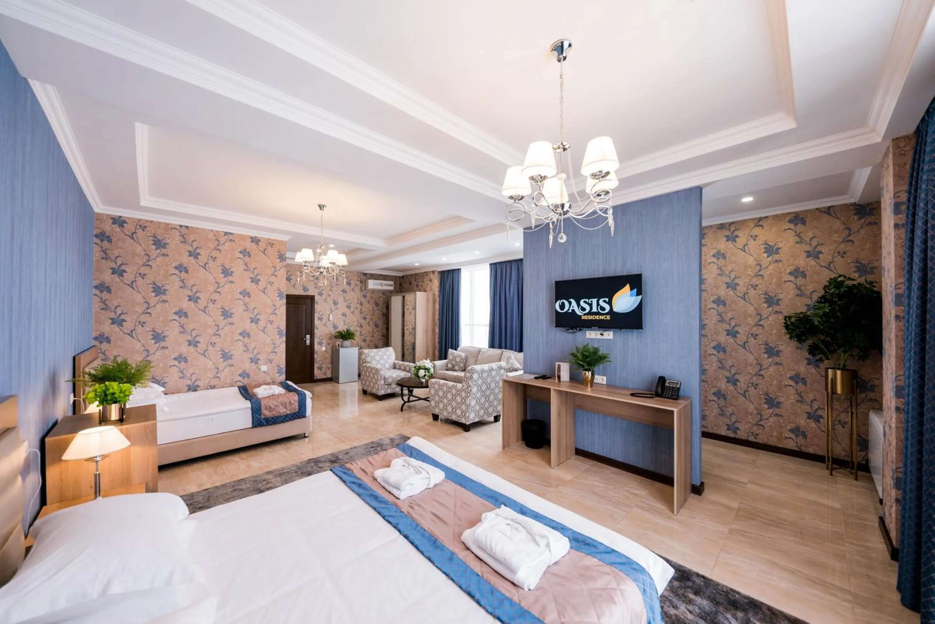 Communal lounge/ TV room, Bed in Oasis Residence