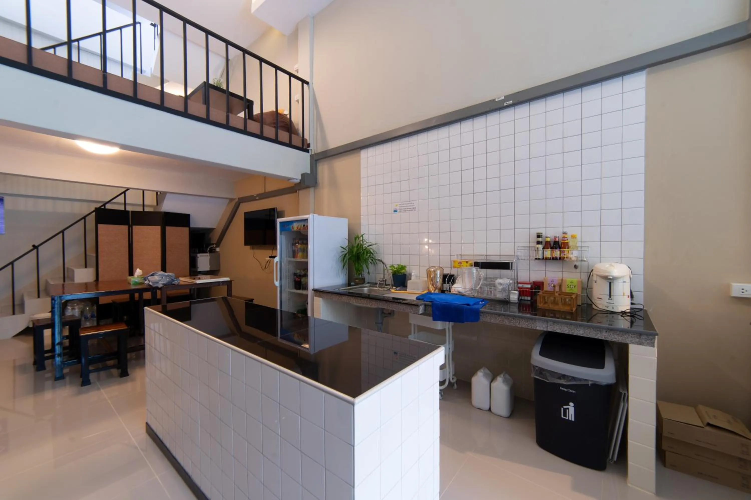 Communal kitchen in Napa Hostel Samrong Station