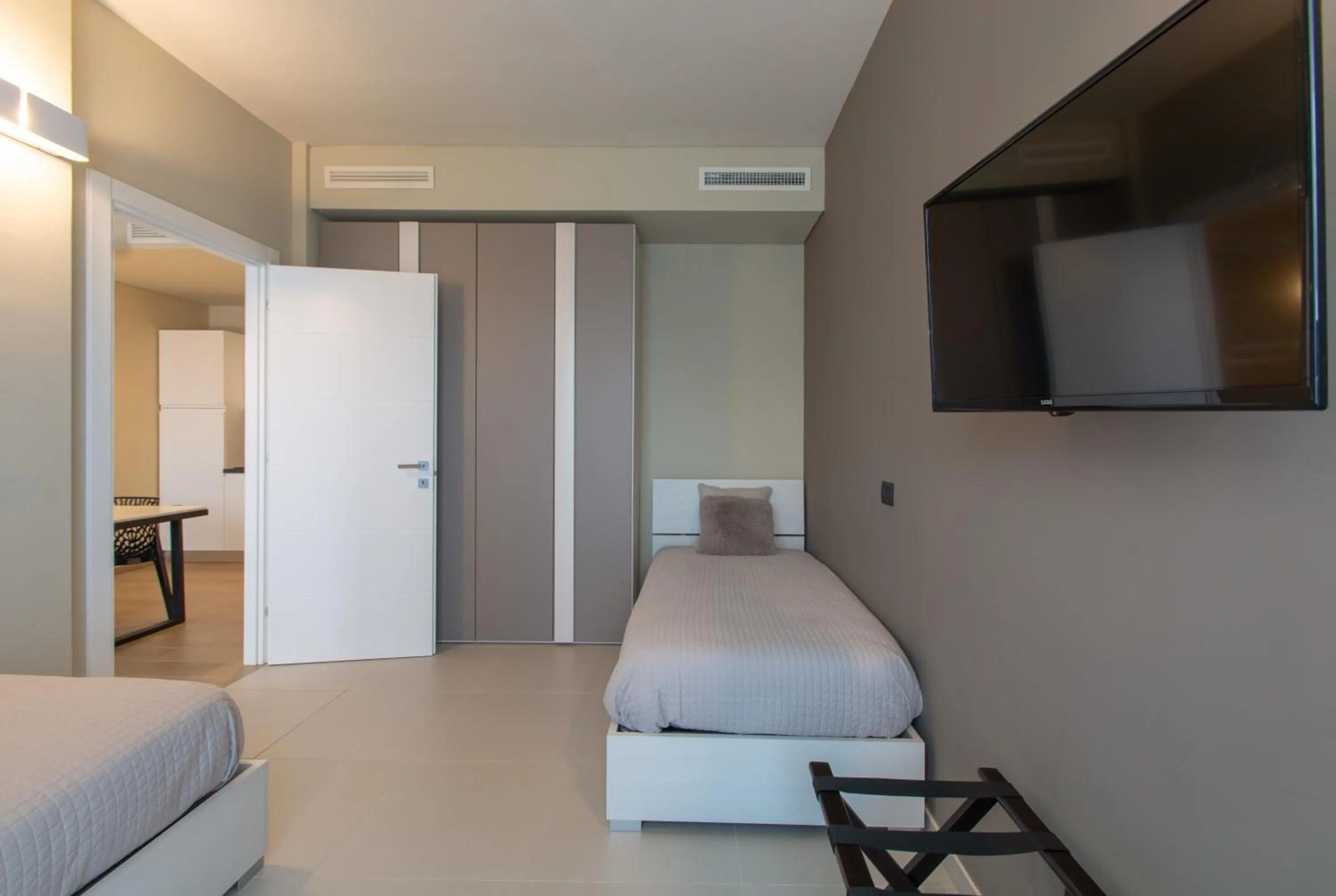 Bed in ATMOSFERA APARTMENTS & SUITES