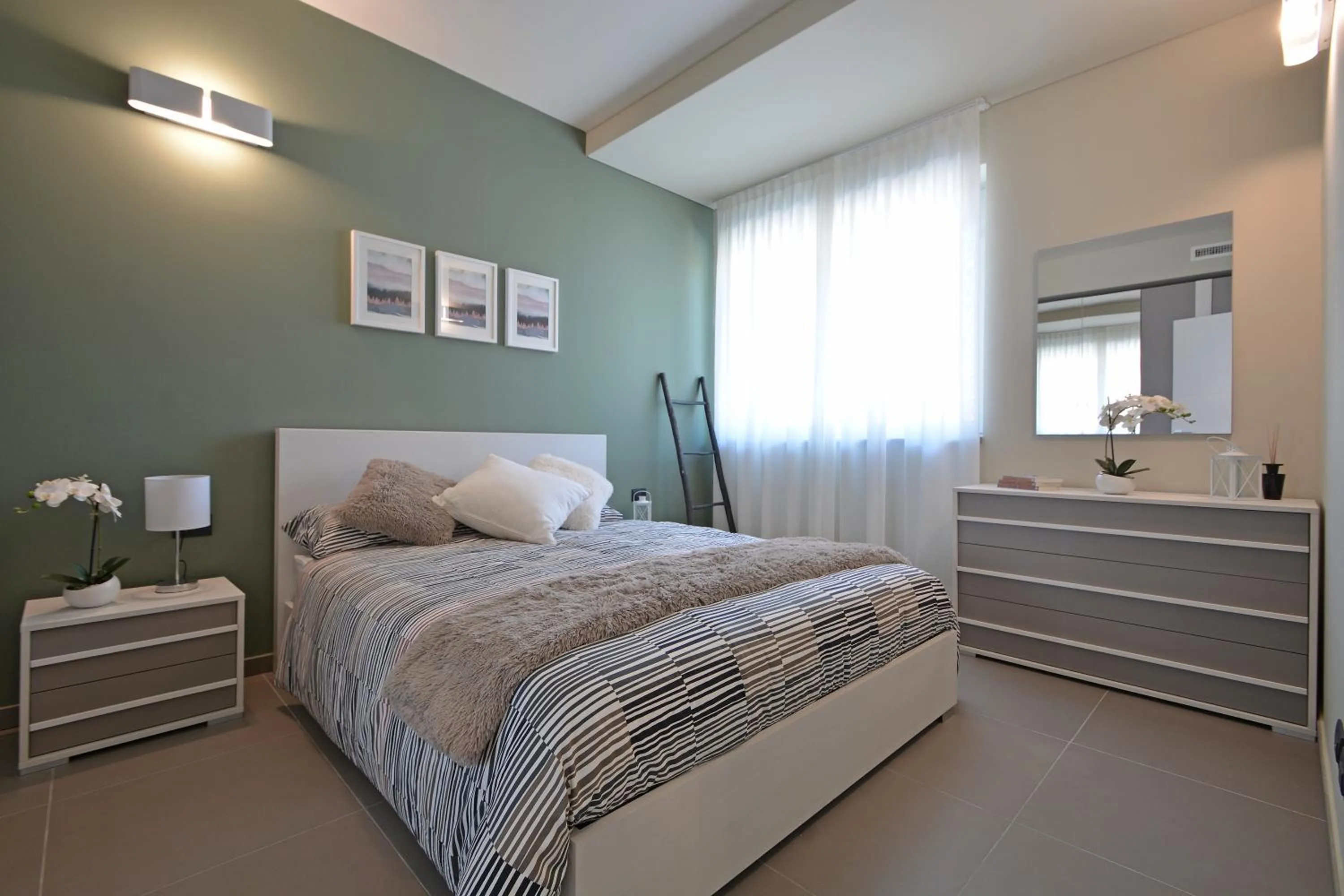 Bed in ATMOSFERA APARTMENTS & SUITES