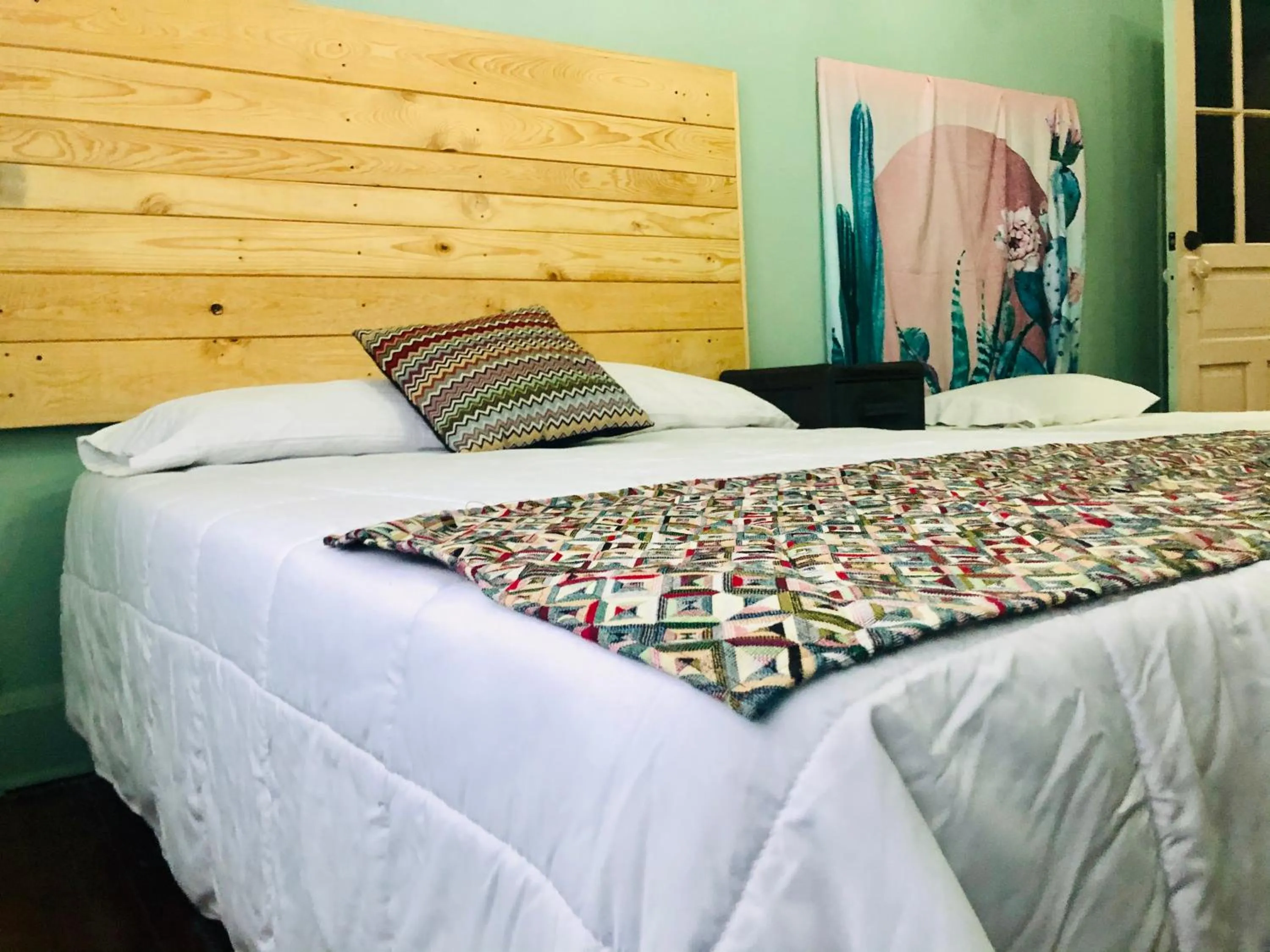 Bed in Hostal Kuira Bá by Rotamundos