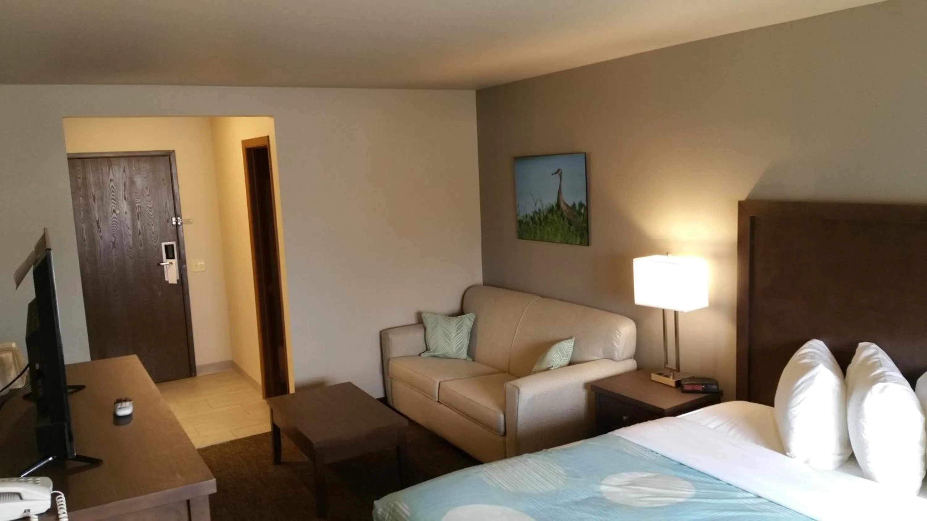 Bed in Sandhill Inn & Suites