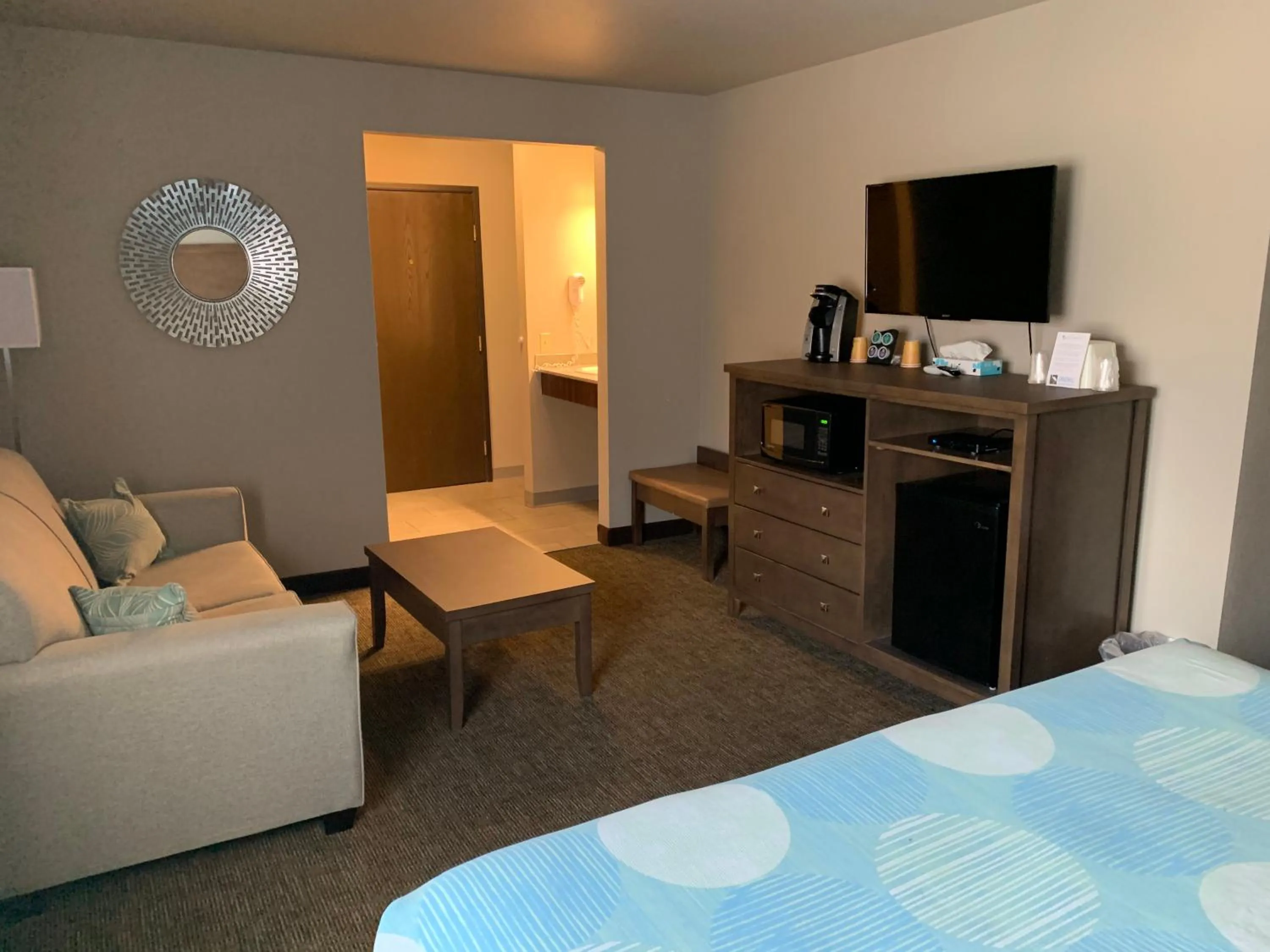 Bed in Sandhill Inn & Suites