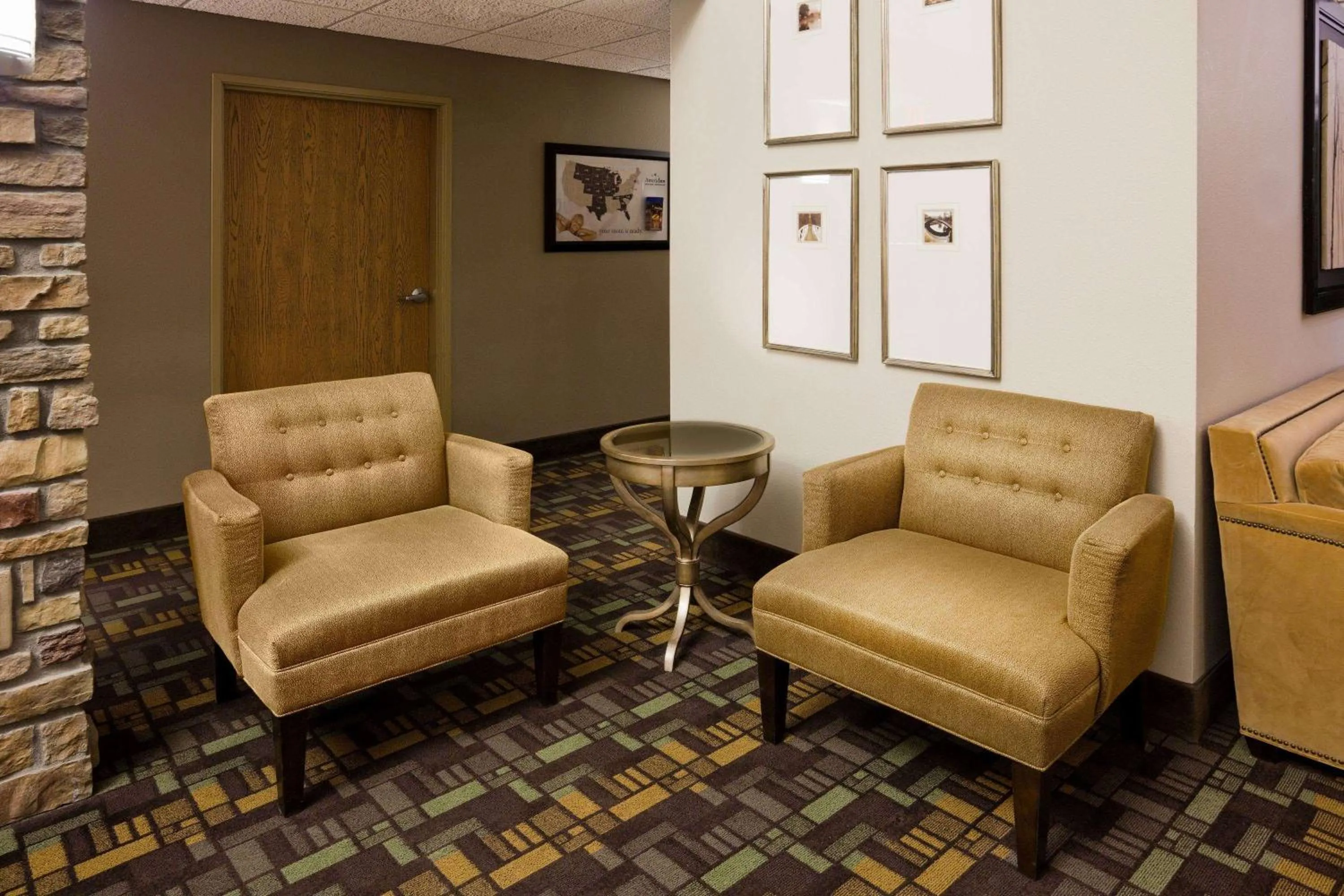 Seating area in AmericInn by Wyndham Osage