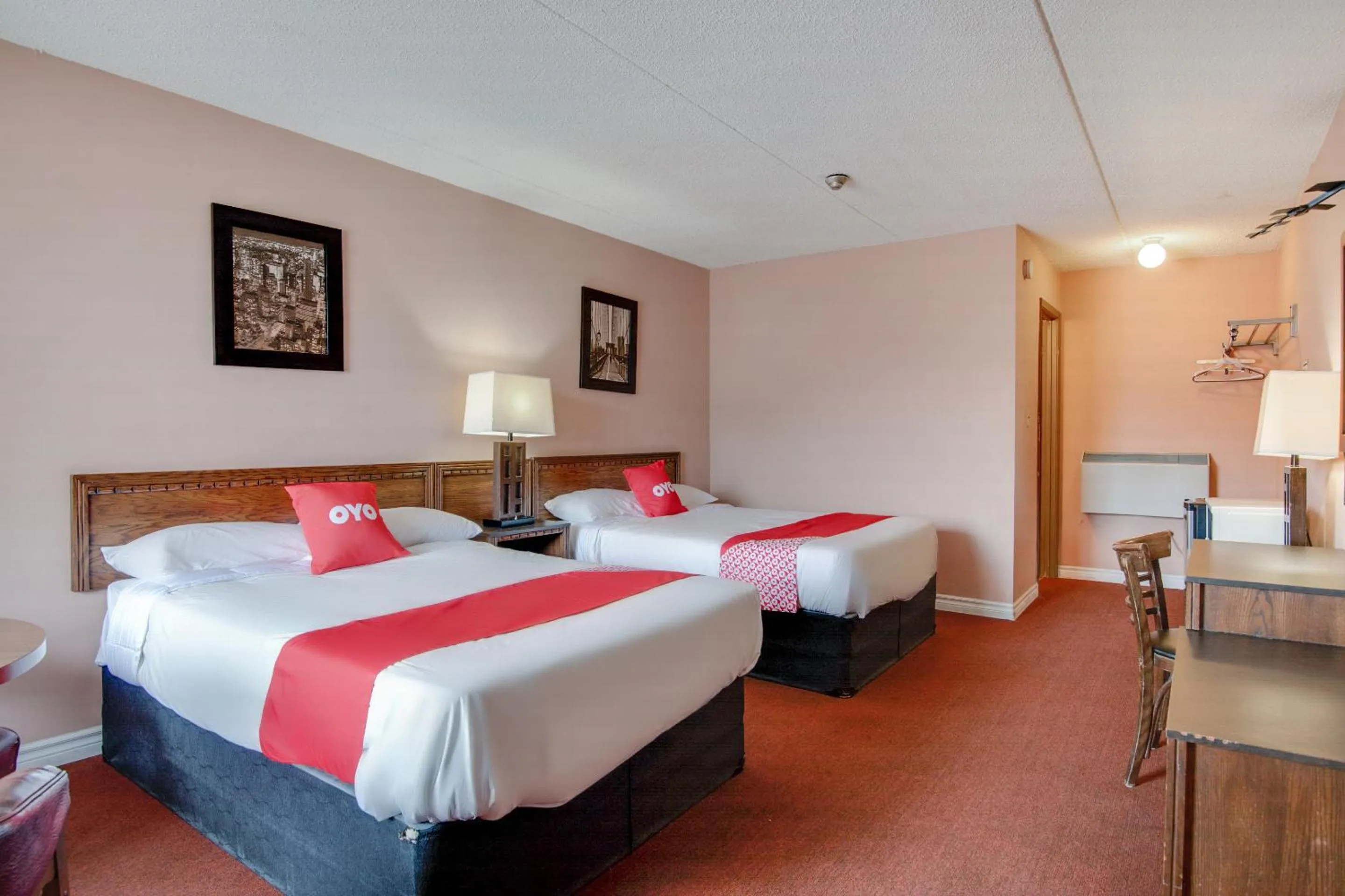 Bedroom in Falls Inn Near Casino Niagara By OYO