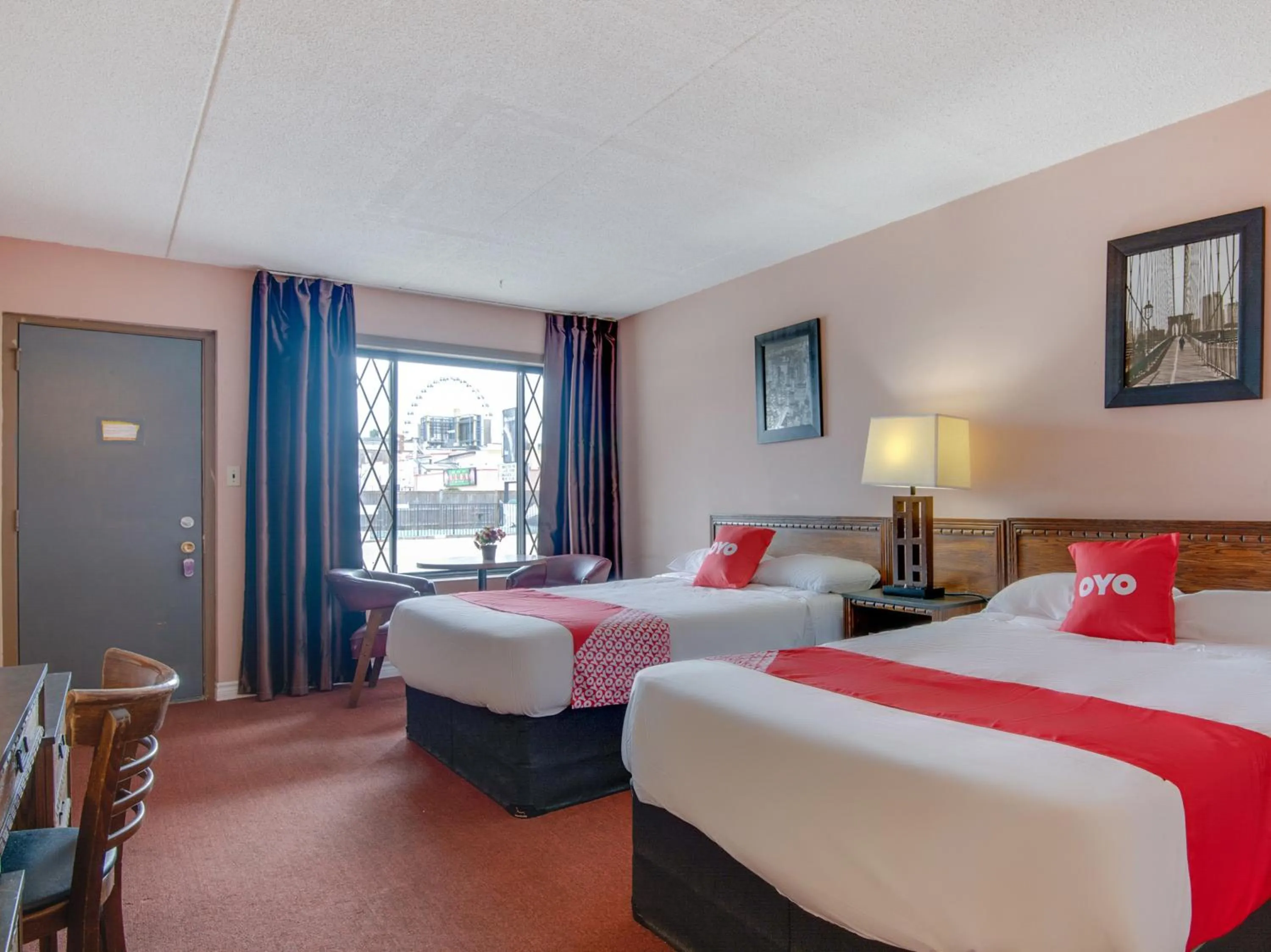 Bedroom in Falls Inn Near Casino Niagara By OYO