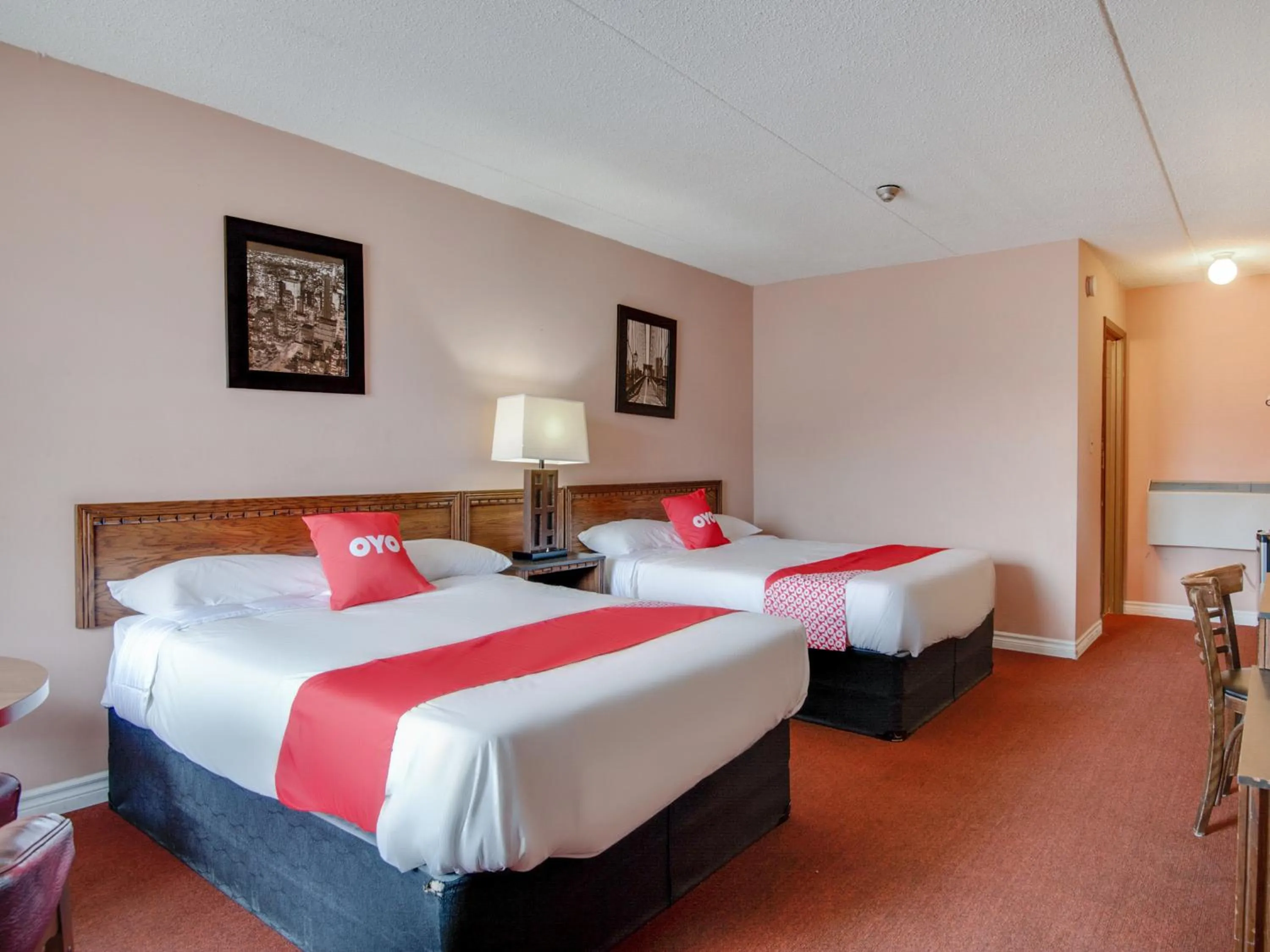 Bedroom in Falls Inn Near Casino Niagara By OYO