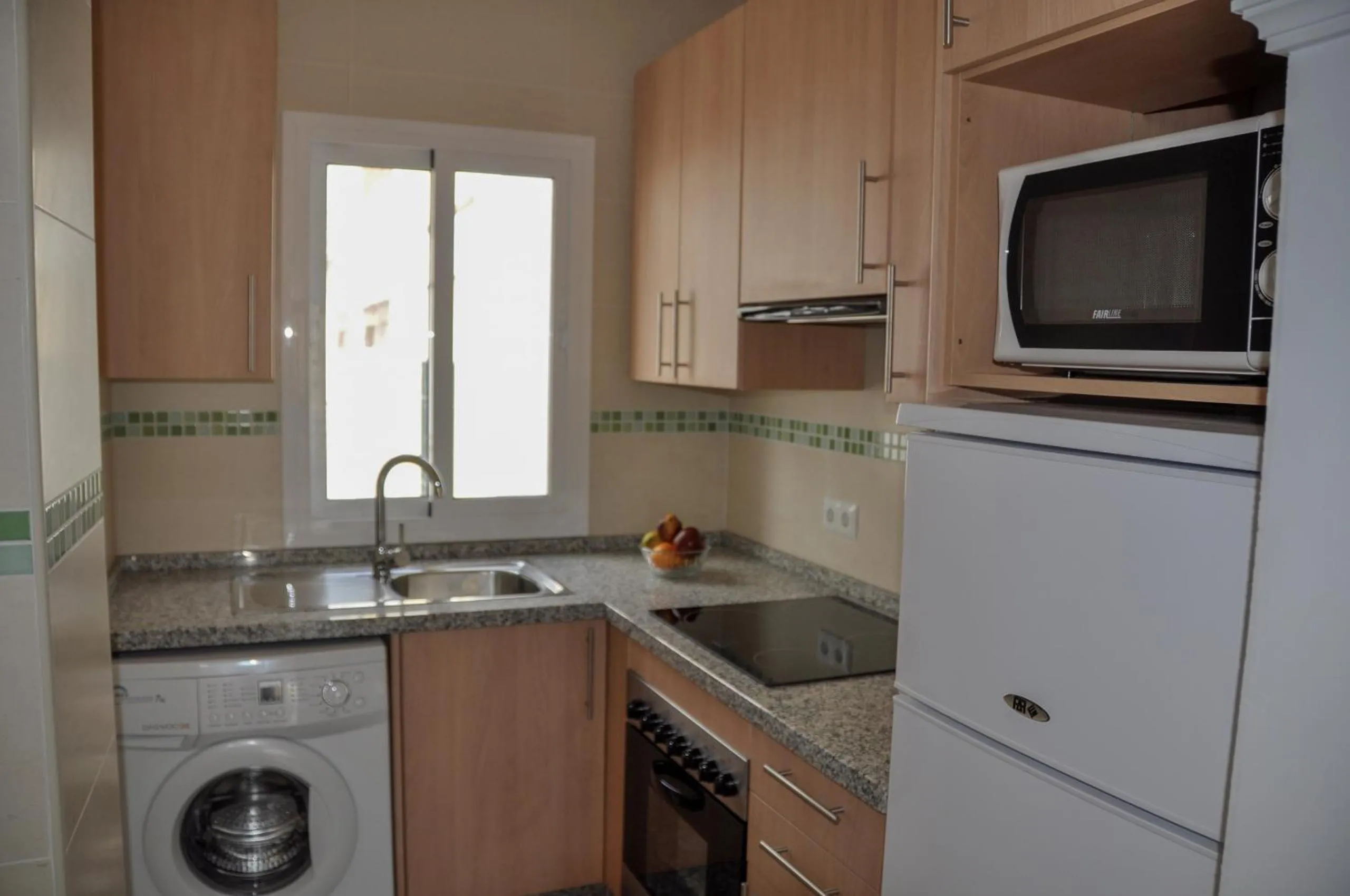 Kitchen or kitchenette in Nerja Paradise Rentals - Apt Chimenea A1E