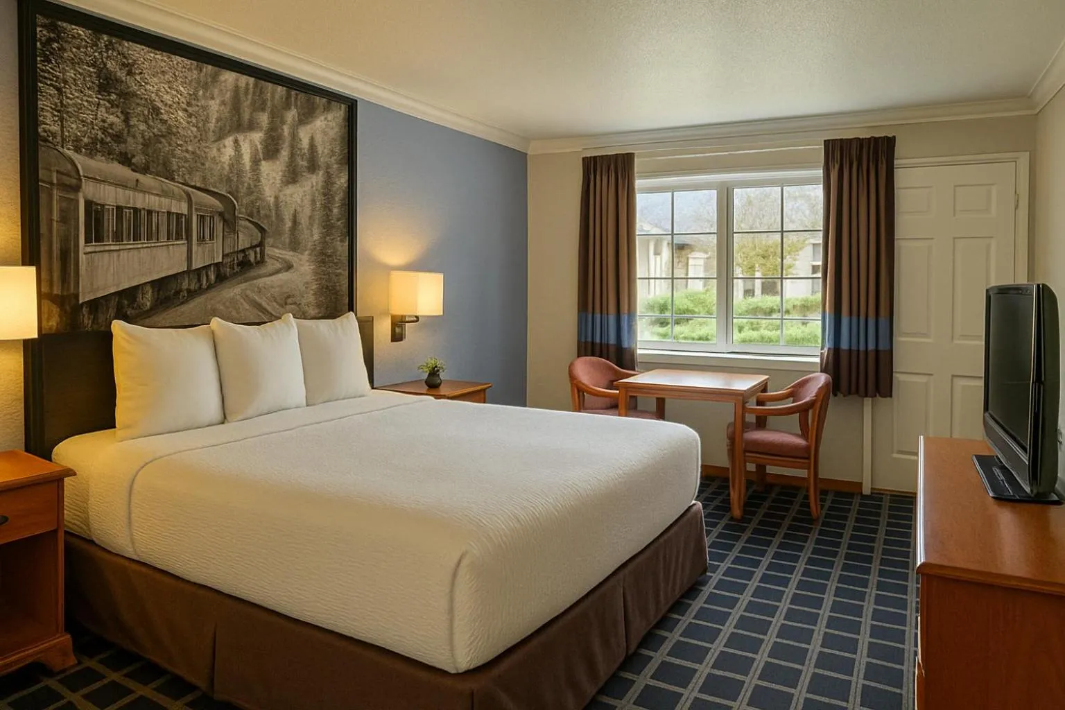 Bed in Creekside Inn & Suites