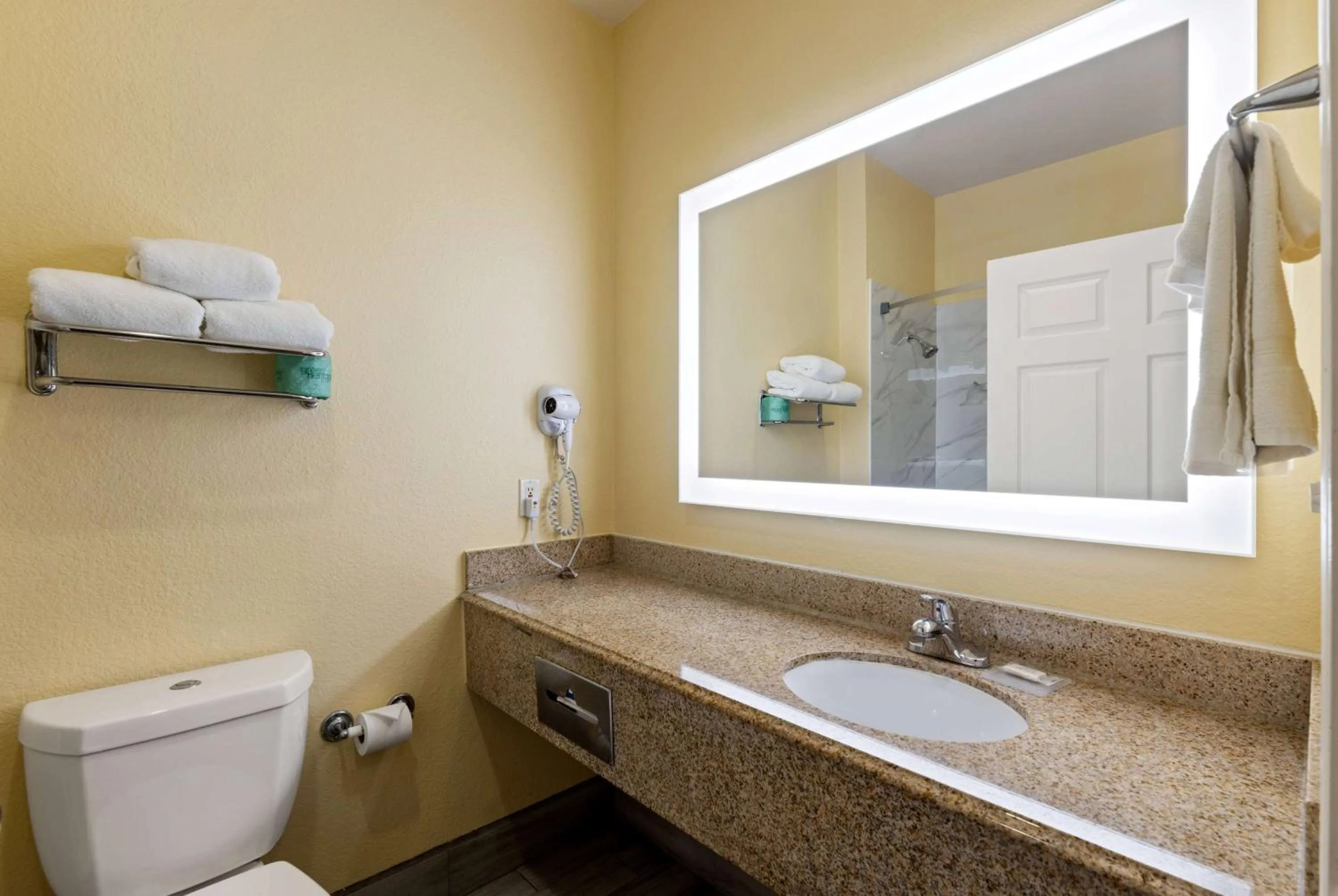 Bathroom in Days Inn & Suites by Wyndham DFW Airport South-Euless