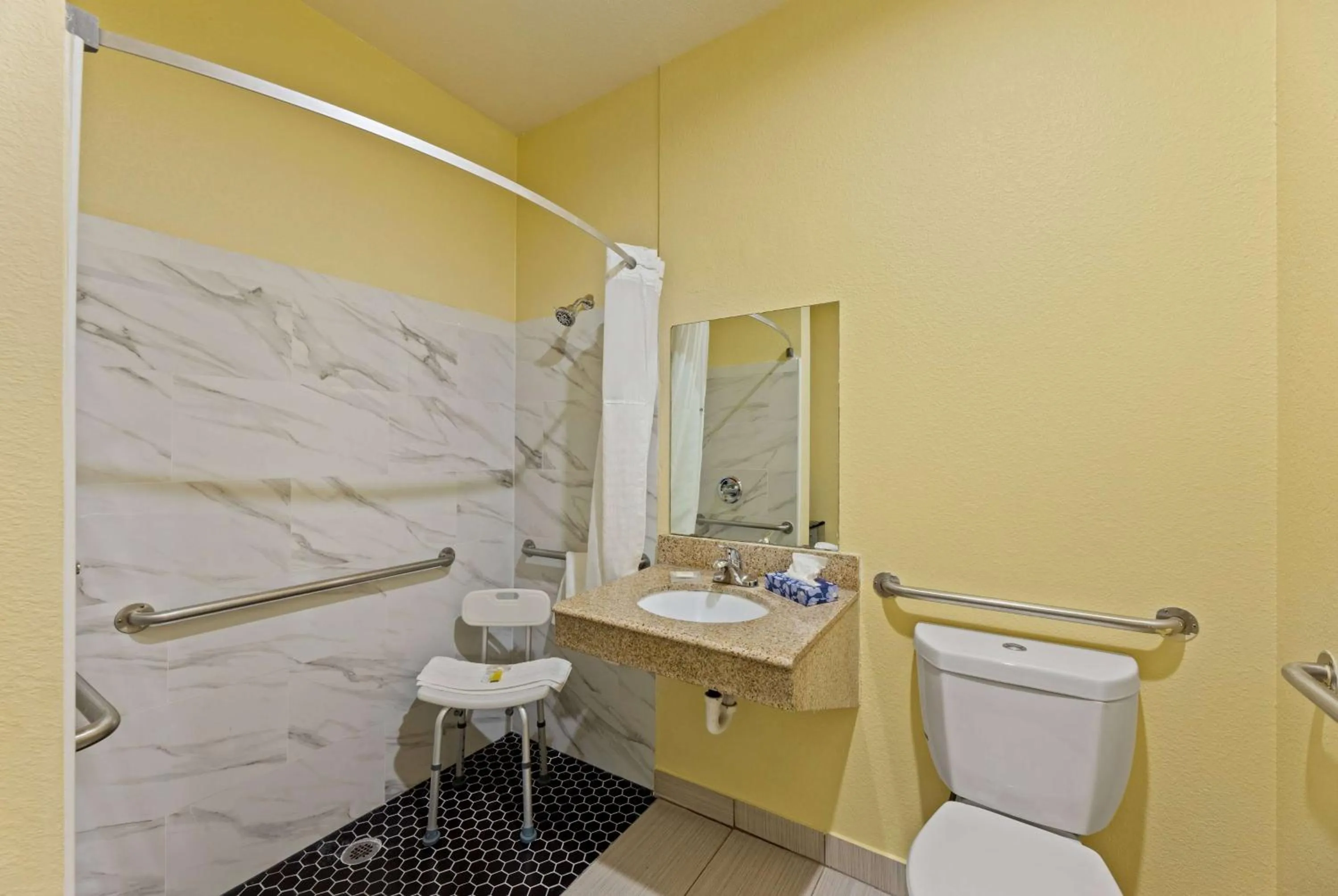 Bathroom in Days Inn & Suites by Wyndham DFW Airport South-Euless