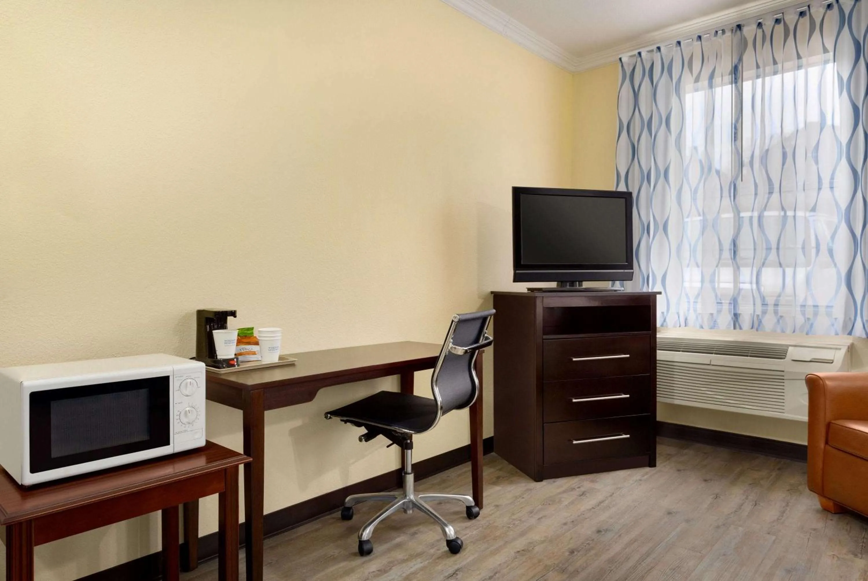 Photo of the whole room in Days Inn & Suites by Wyndham DFW Airport South-Euless