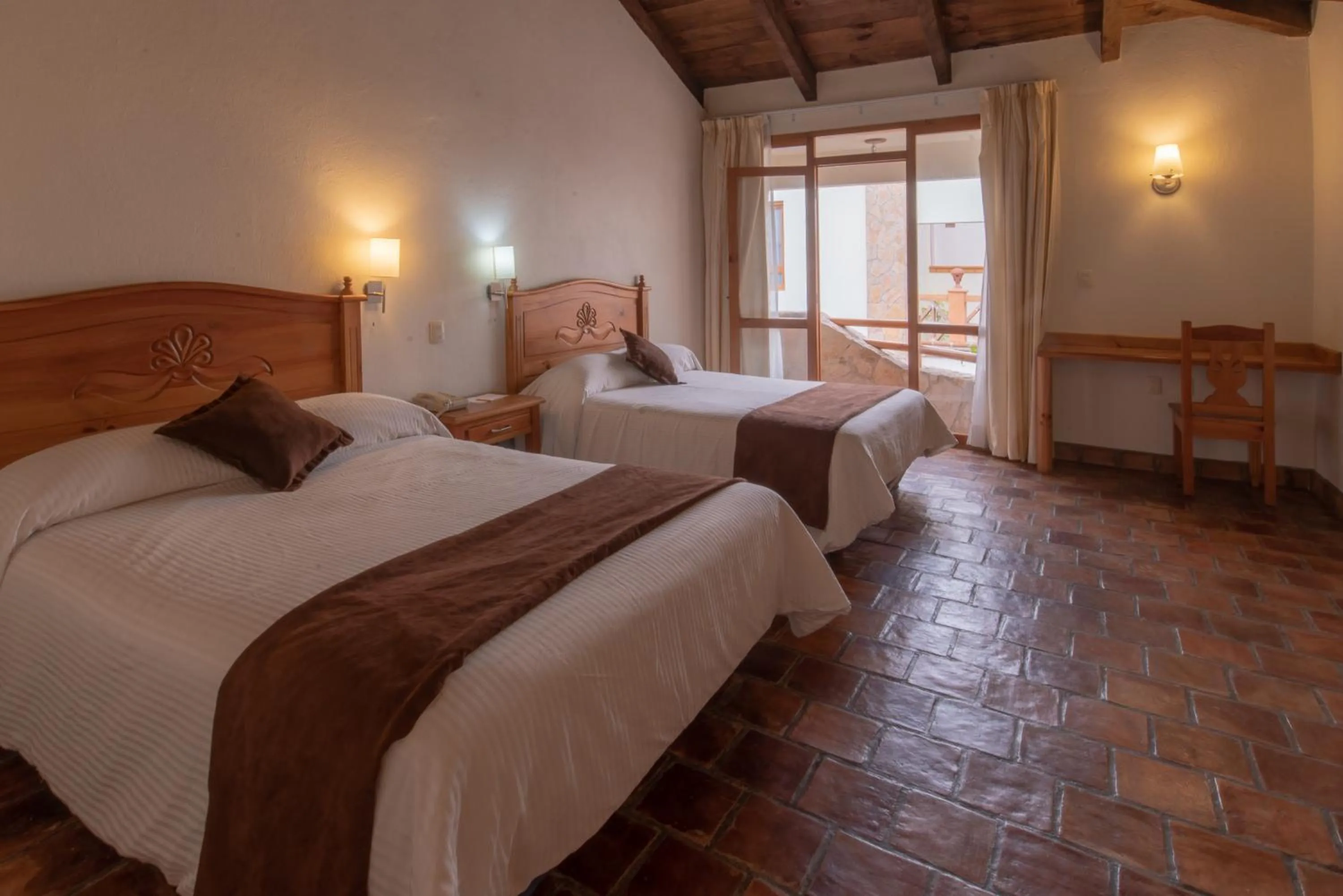 Bed in Plaza Magnolias Suites