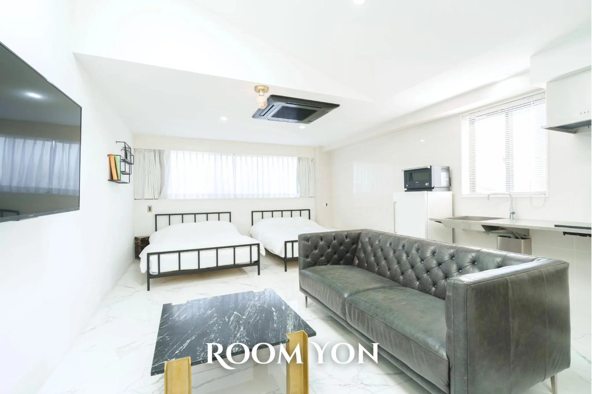 Kitchen or kitchenette, Bed in THE ROOT2 HOTEL