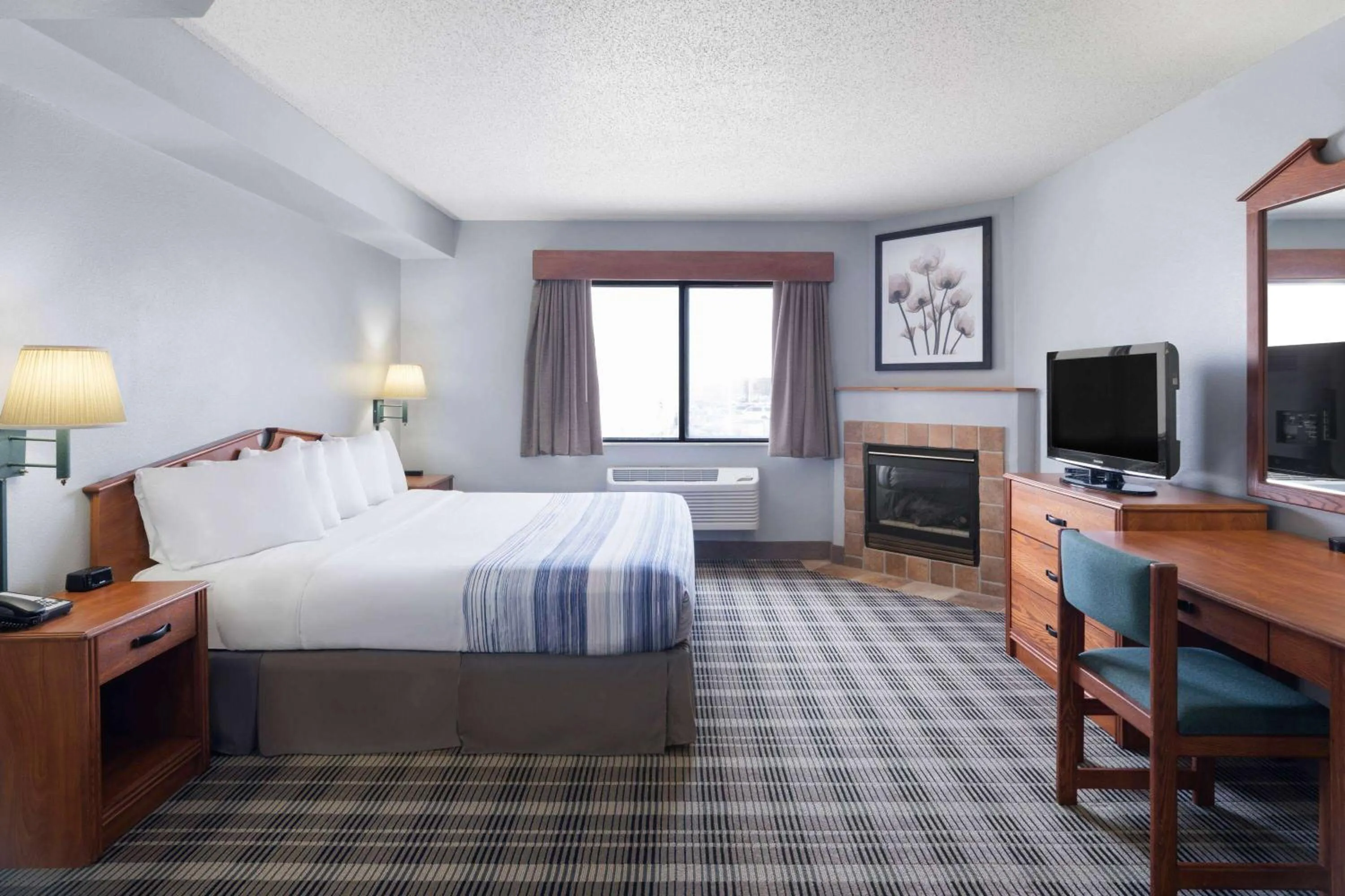 Photo of the whole room, Bed in AmericInn by Wyndham Stuart