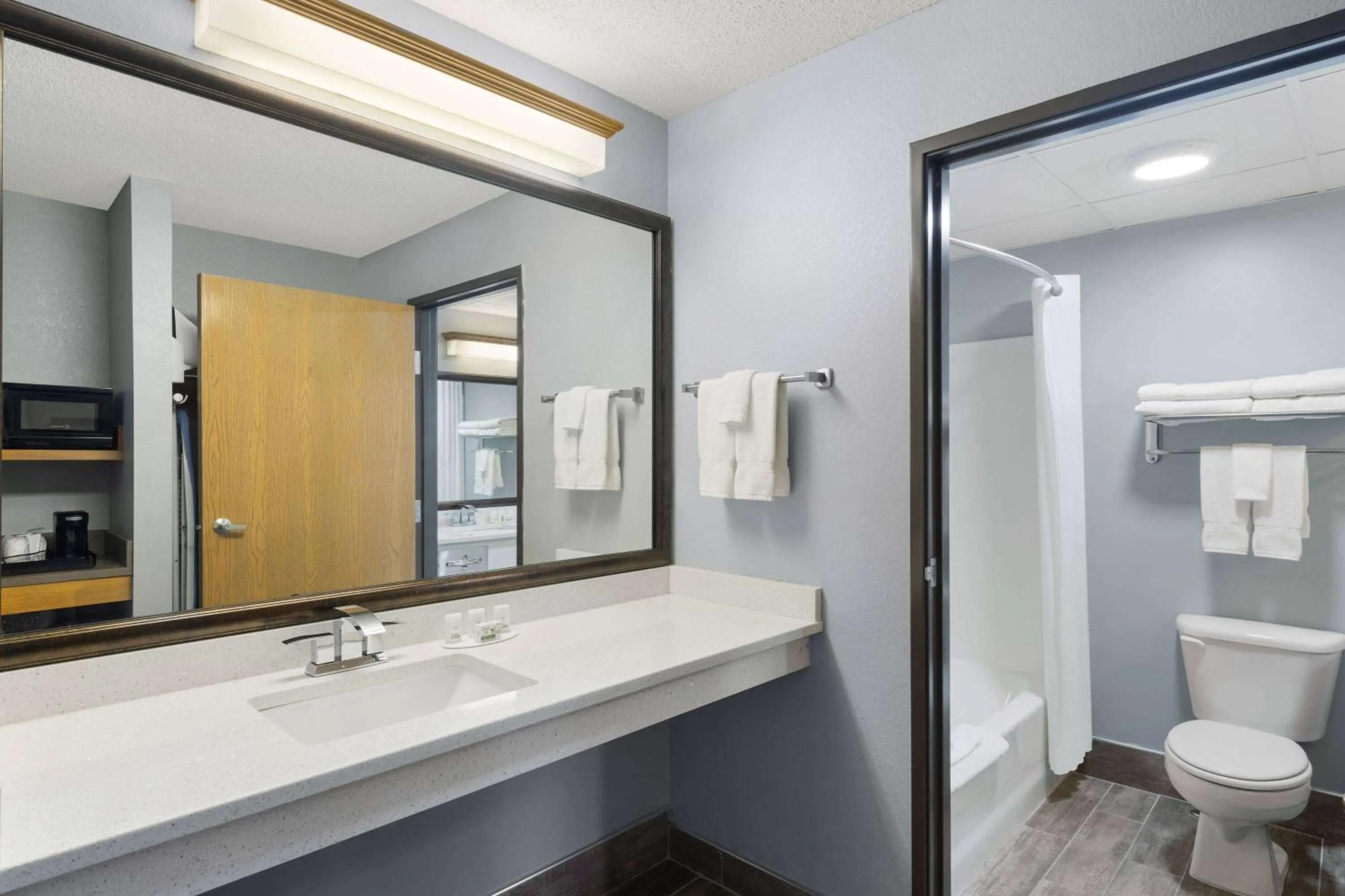 Bathroom in AmericInn by Wyndham Stuart