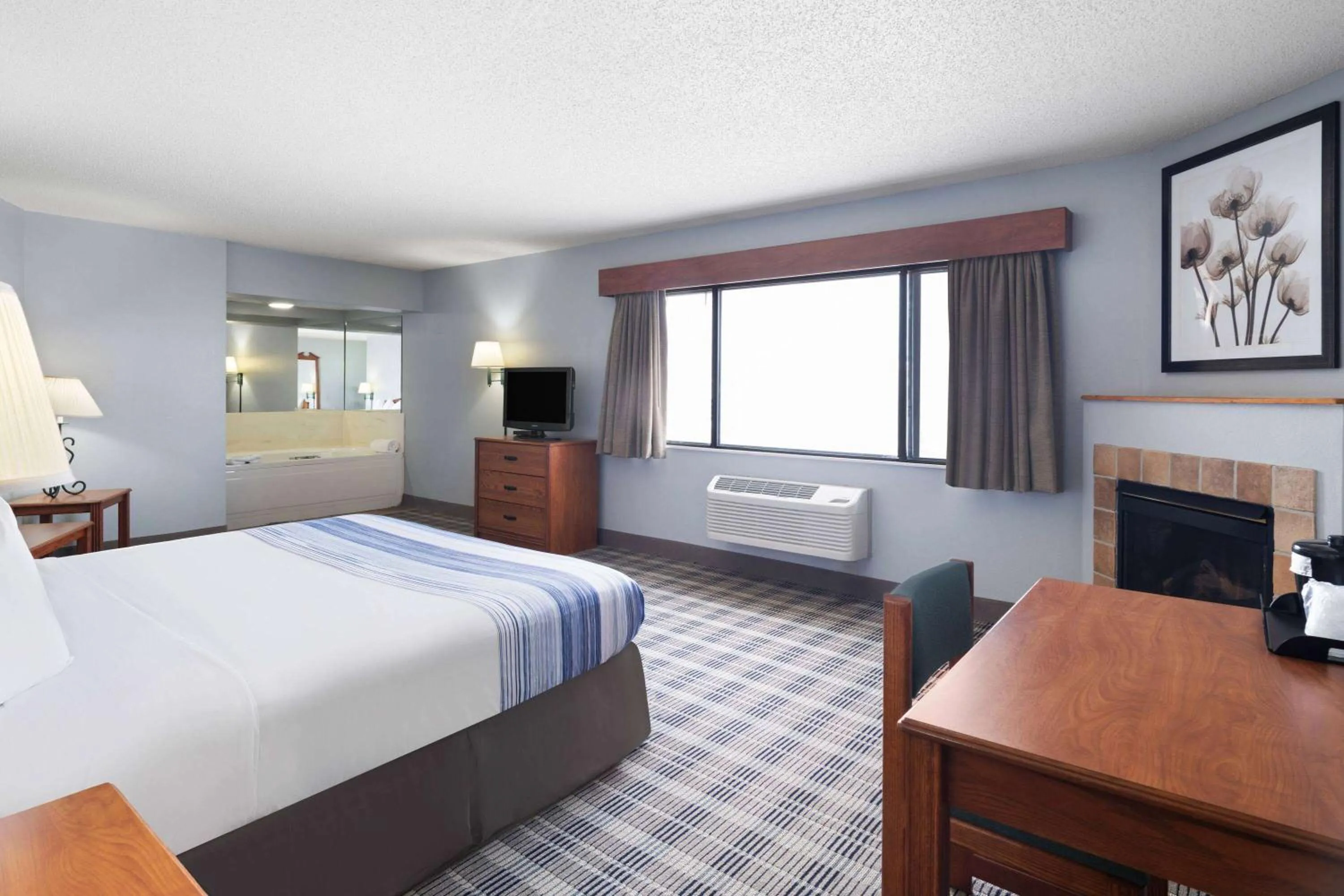 Photo of the whole room, Bed in AmericInn by Wyndham Stuart