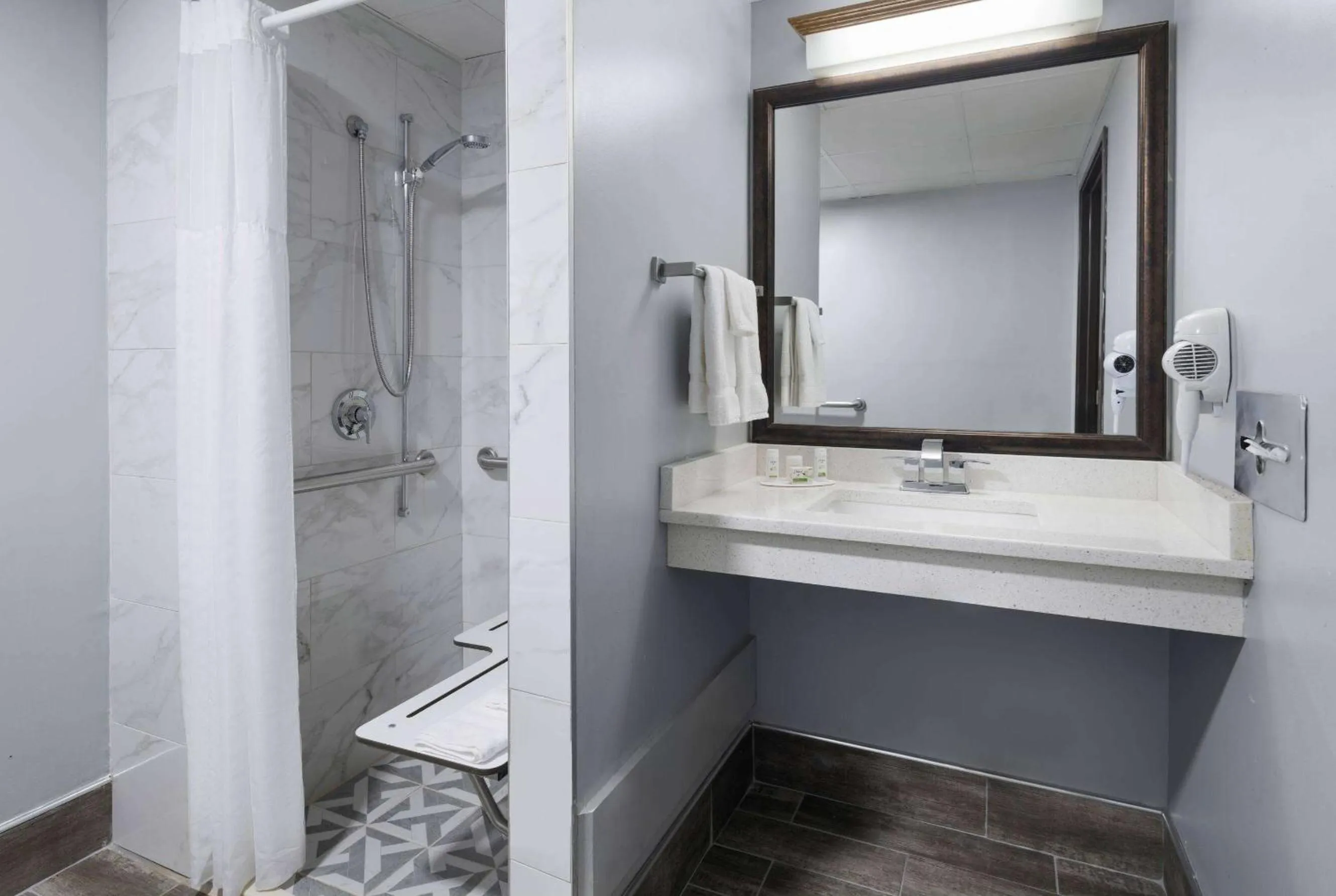 Shower in AmericInn by Wyndham Stuart