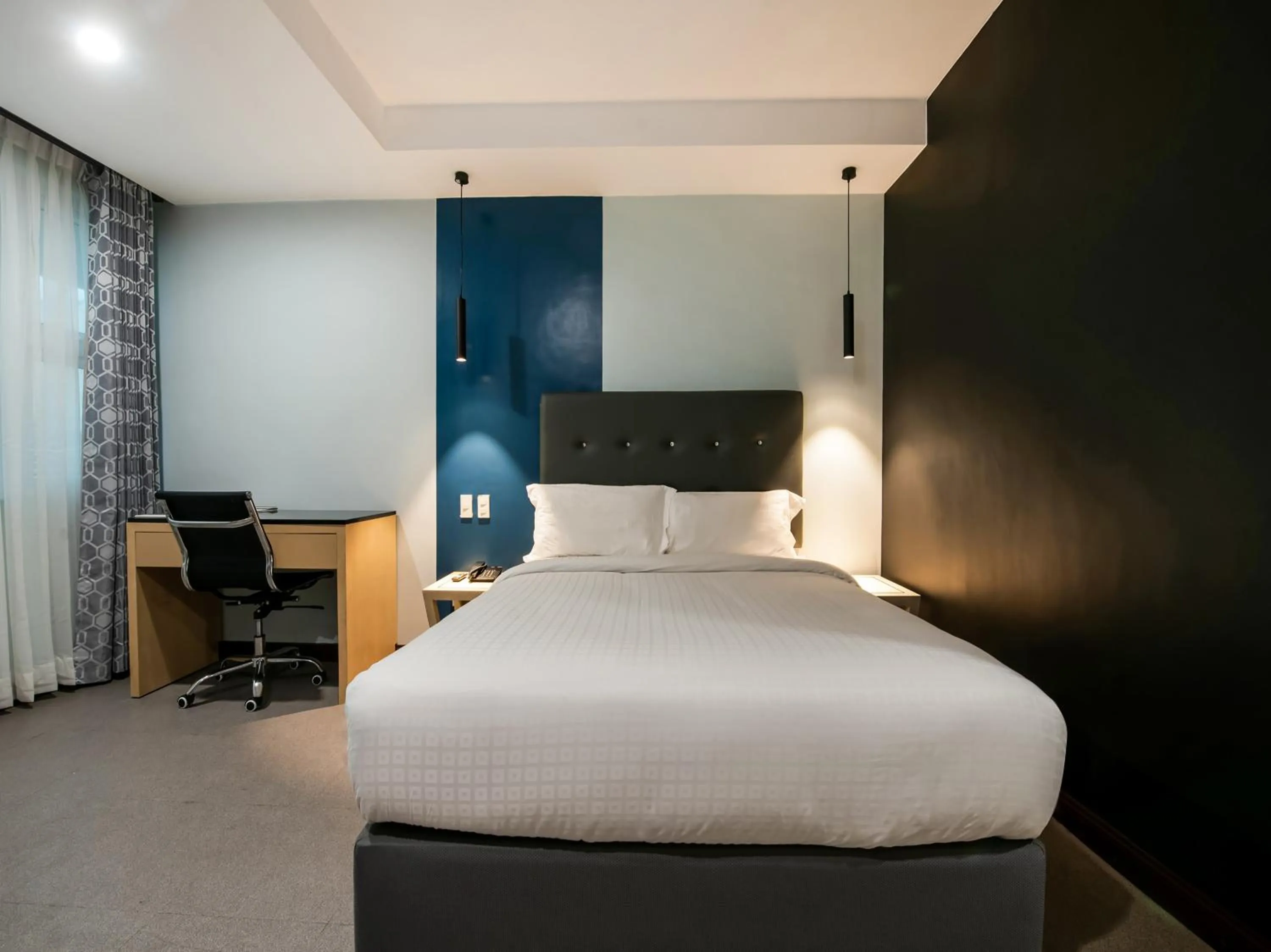 Bed in Bay Area Suites Manila