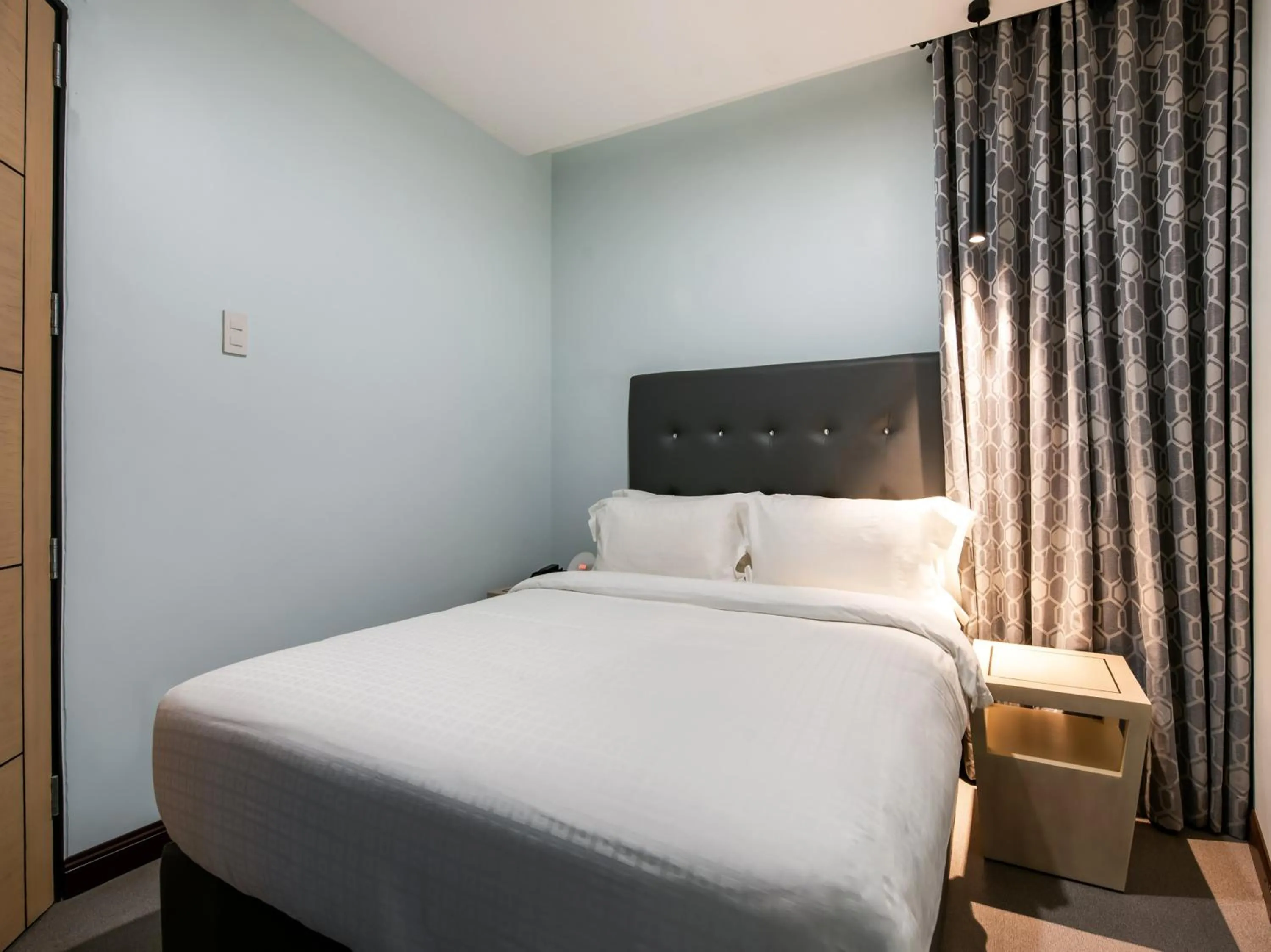 Bed in Bay Area Suites Manila