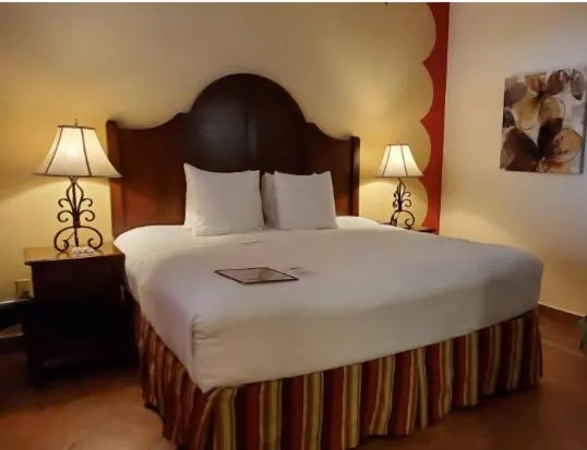 Bed in Los Arboles Hotel