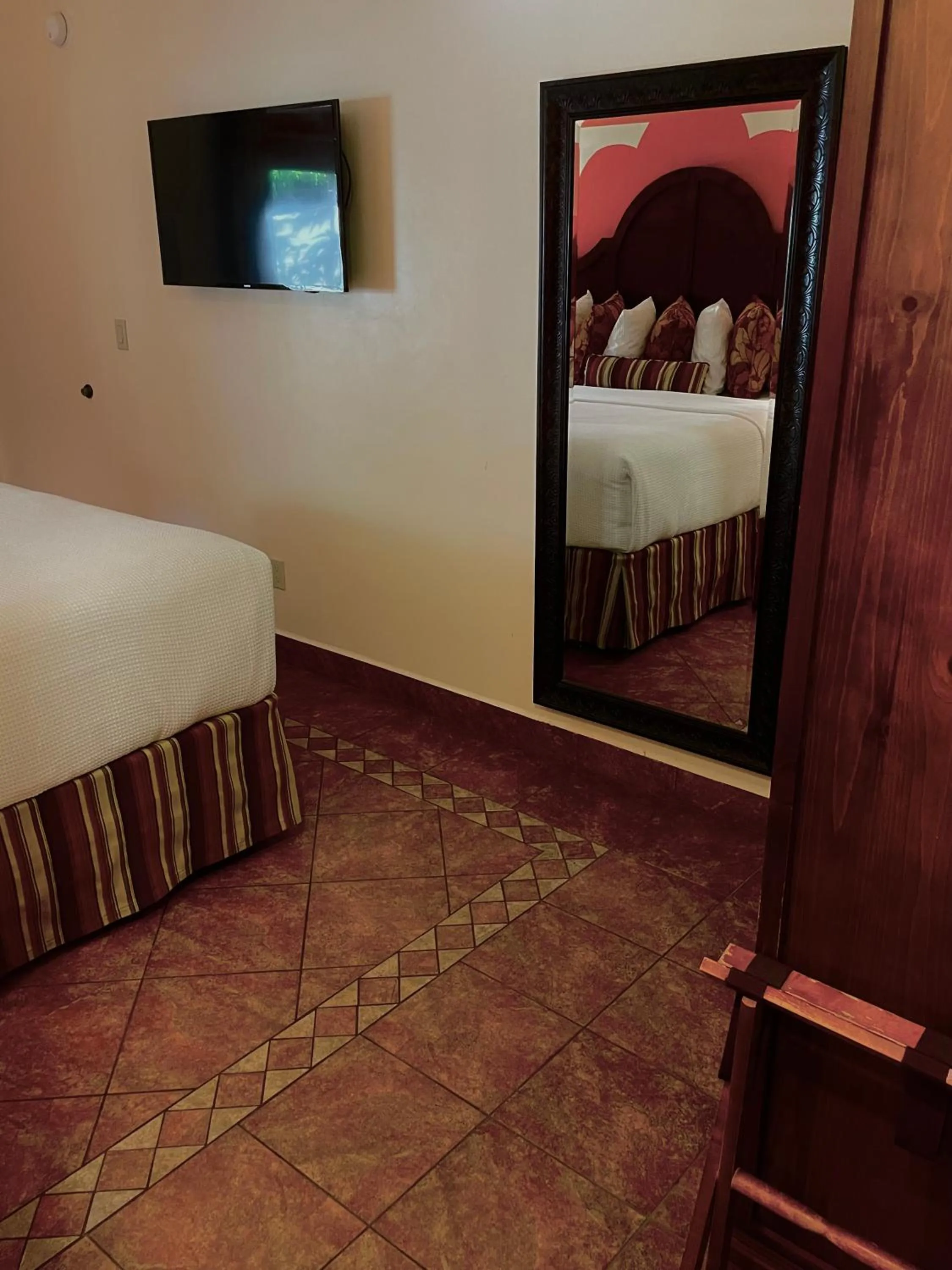 Bed in Los Arboles Hotel