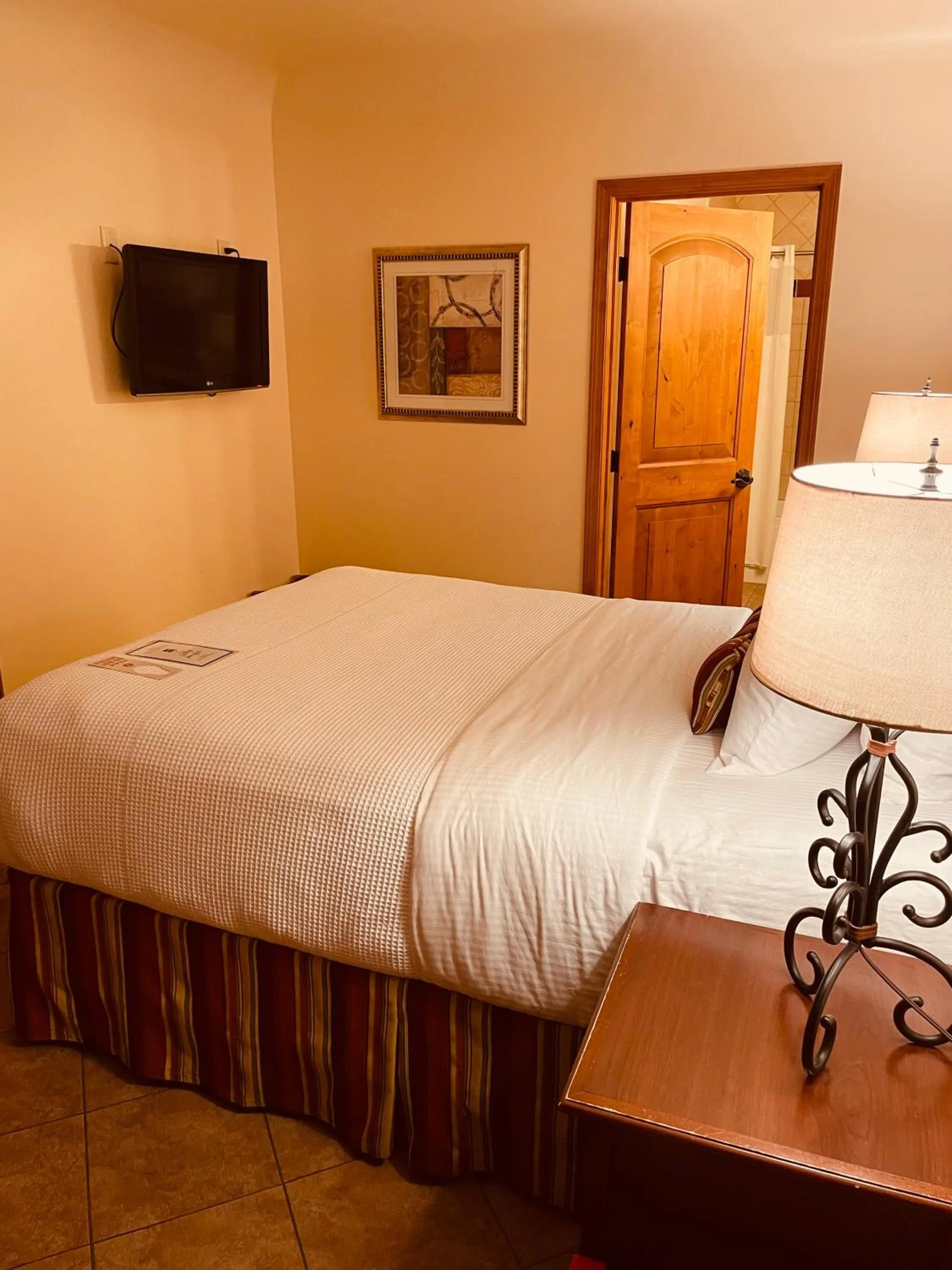 Bed in Los Arboles Hotel