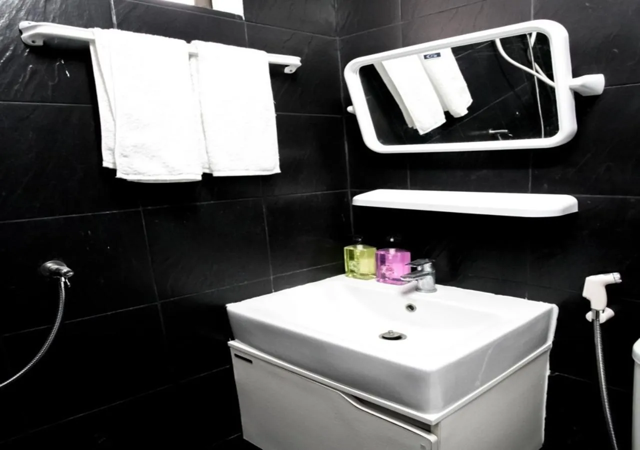 Bathroom in RoomQuest Bangkok Ratchada