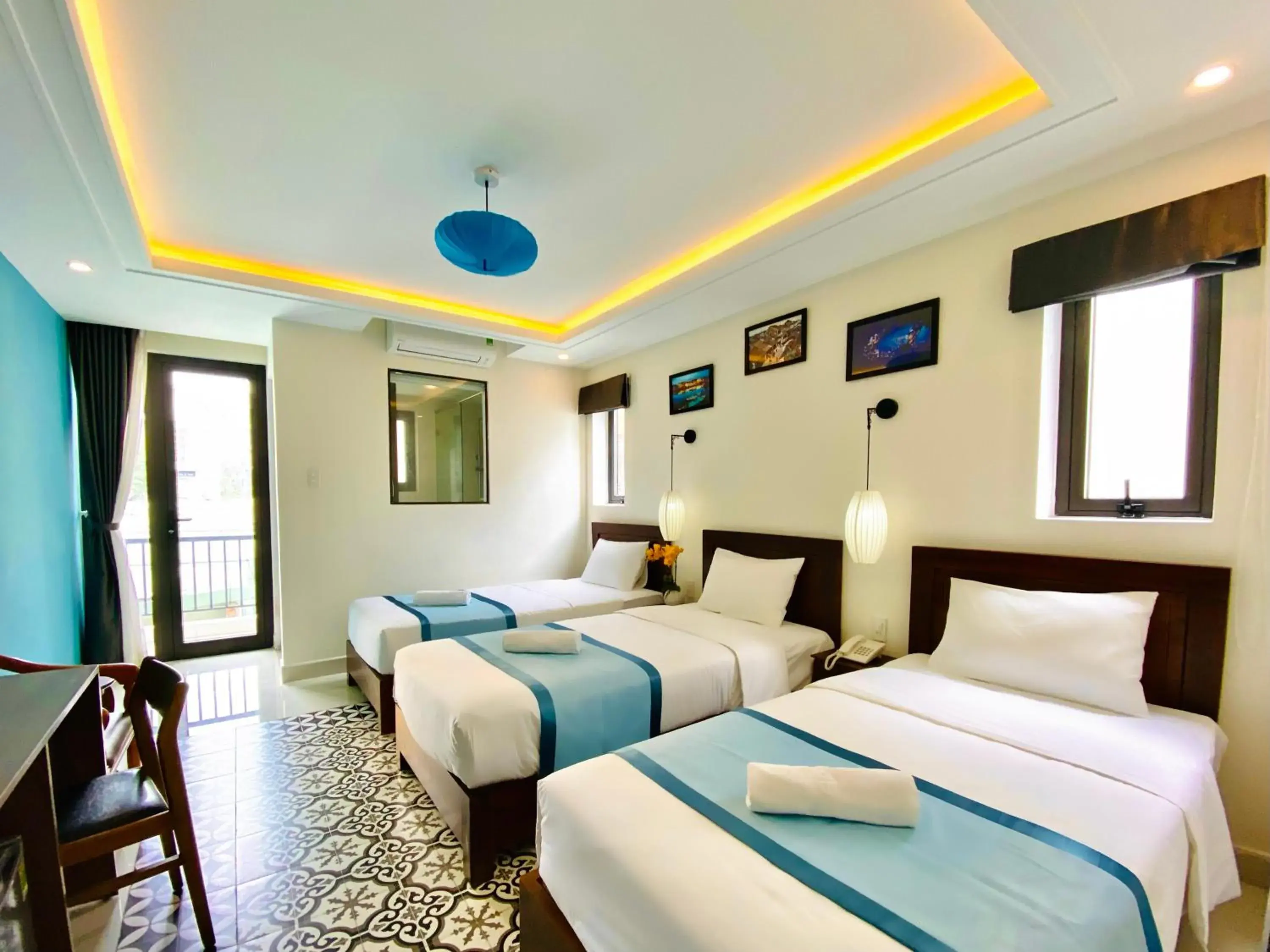 Deluxe Triple Room in Grand Holiday Hoian Villa Deluxe Triple Room in Grand Holiday Hoian Villa