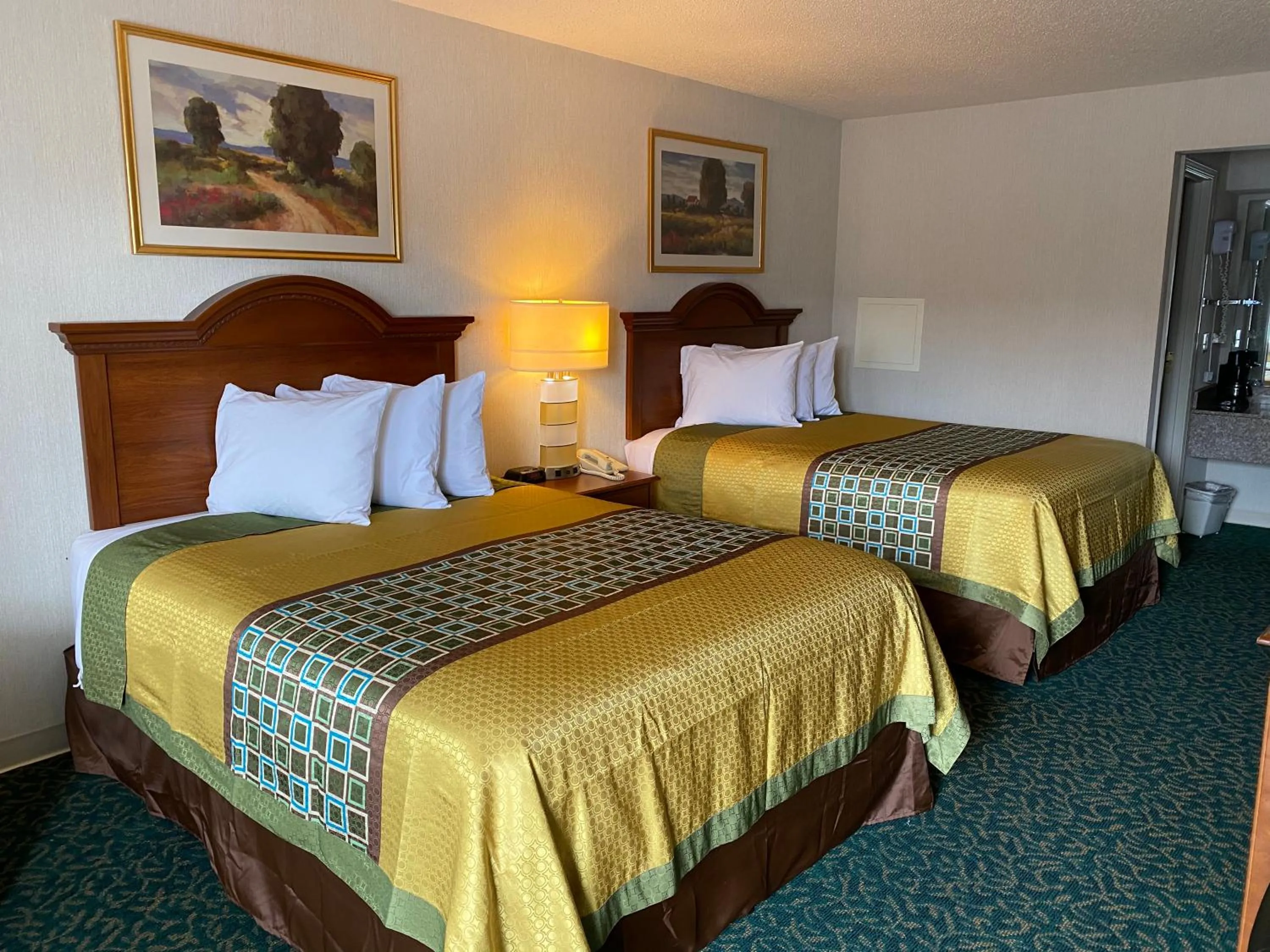 Bed in Harrisonville Inn & Suites