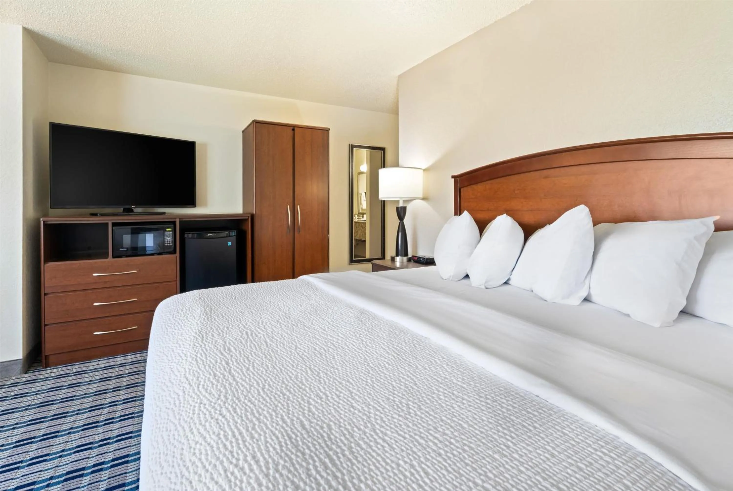 Photo of the whole room, Bed in AmericInn by Wyndham Dickinson