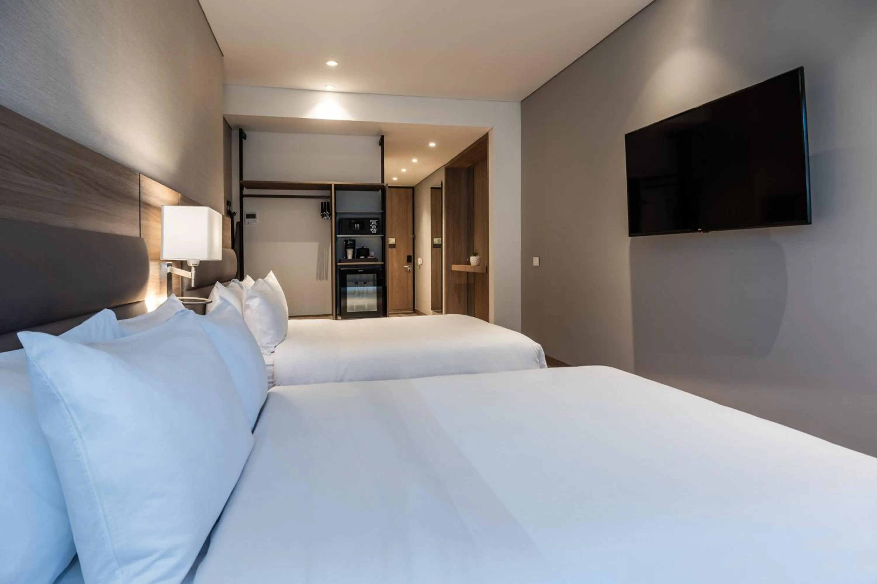 Photo of the whole room, Bed in AC Hotel by Marriott Bogota Zona T