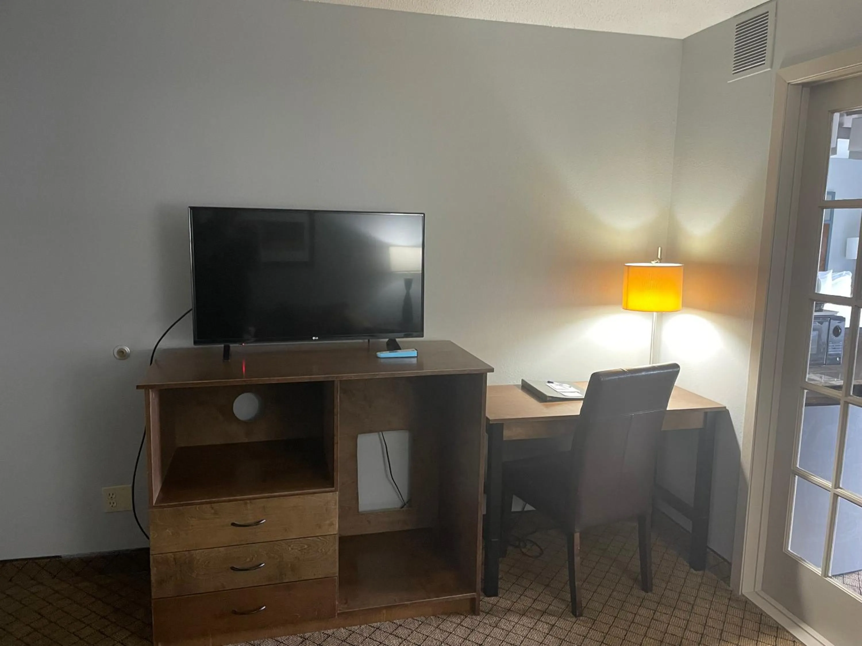 TV and multimedia in AmericInn by Wyndham Hartford WI