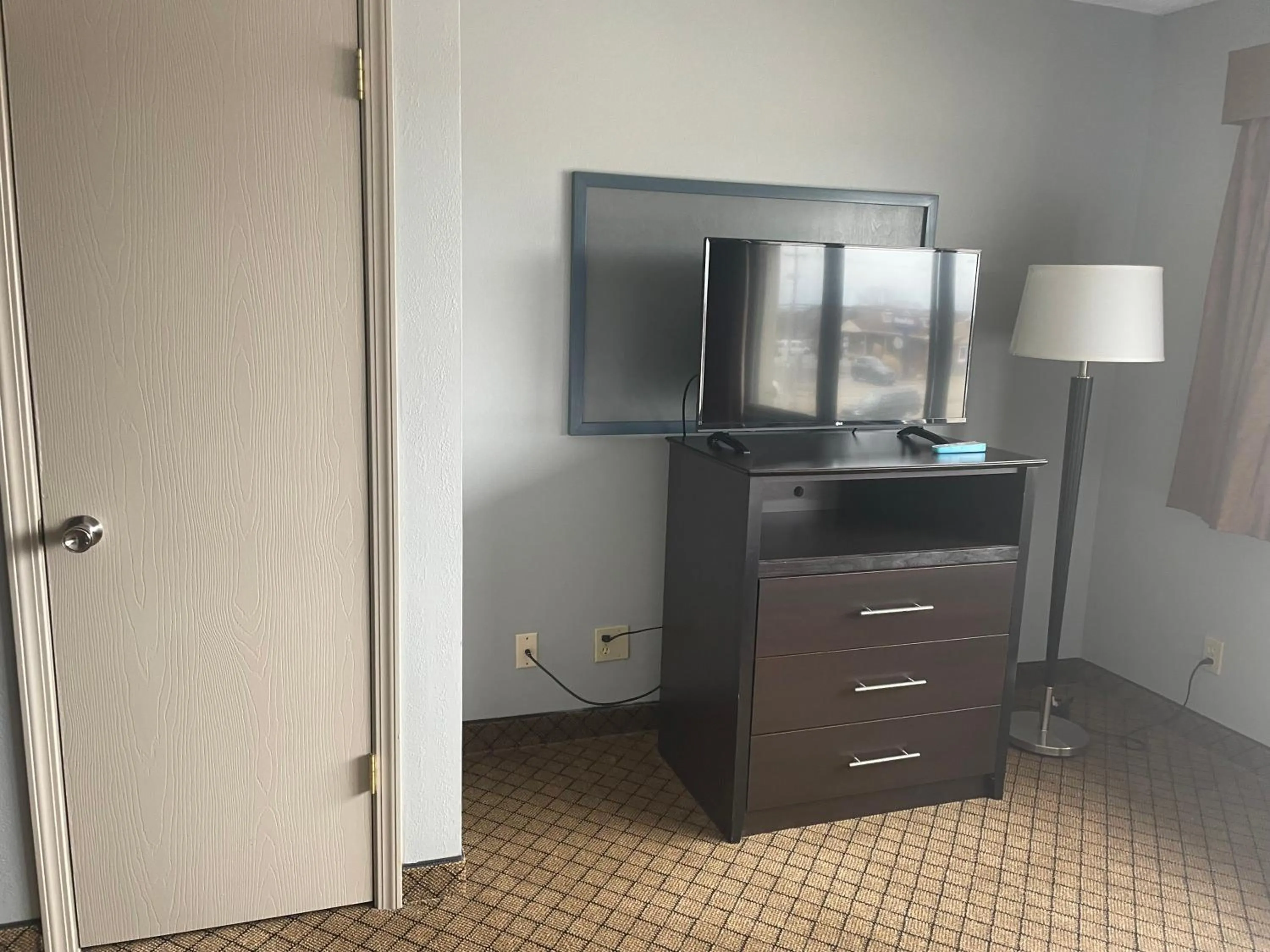TV and multimedia in AmericInn by Wyndham Hartford WI