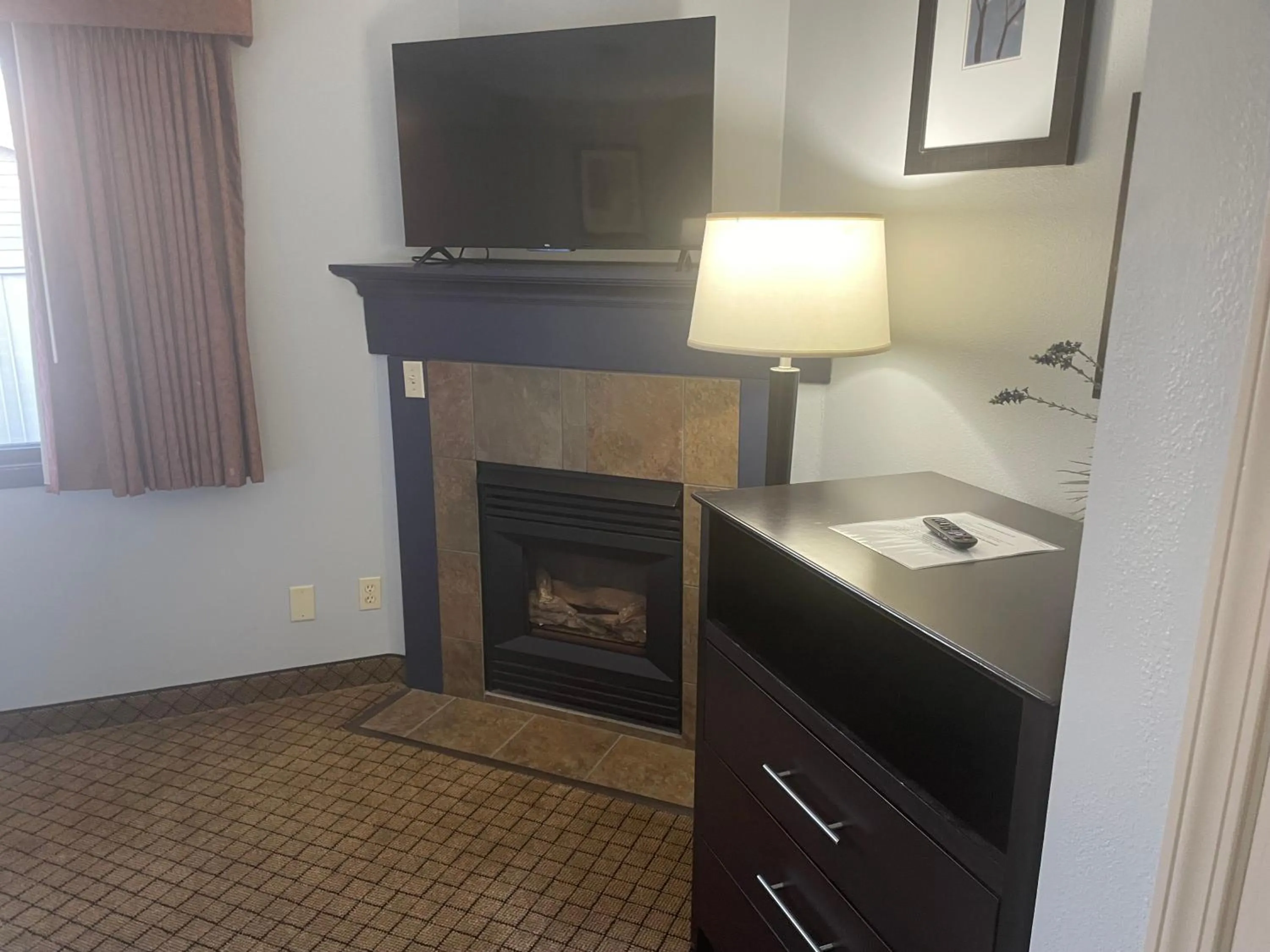 TV and multimedia in AmericInn by Wyndham Hartford WI