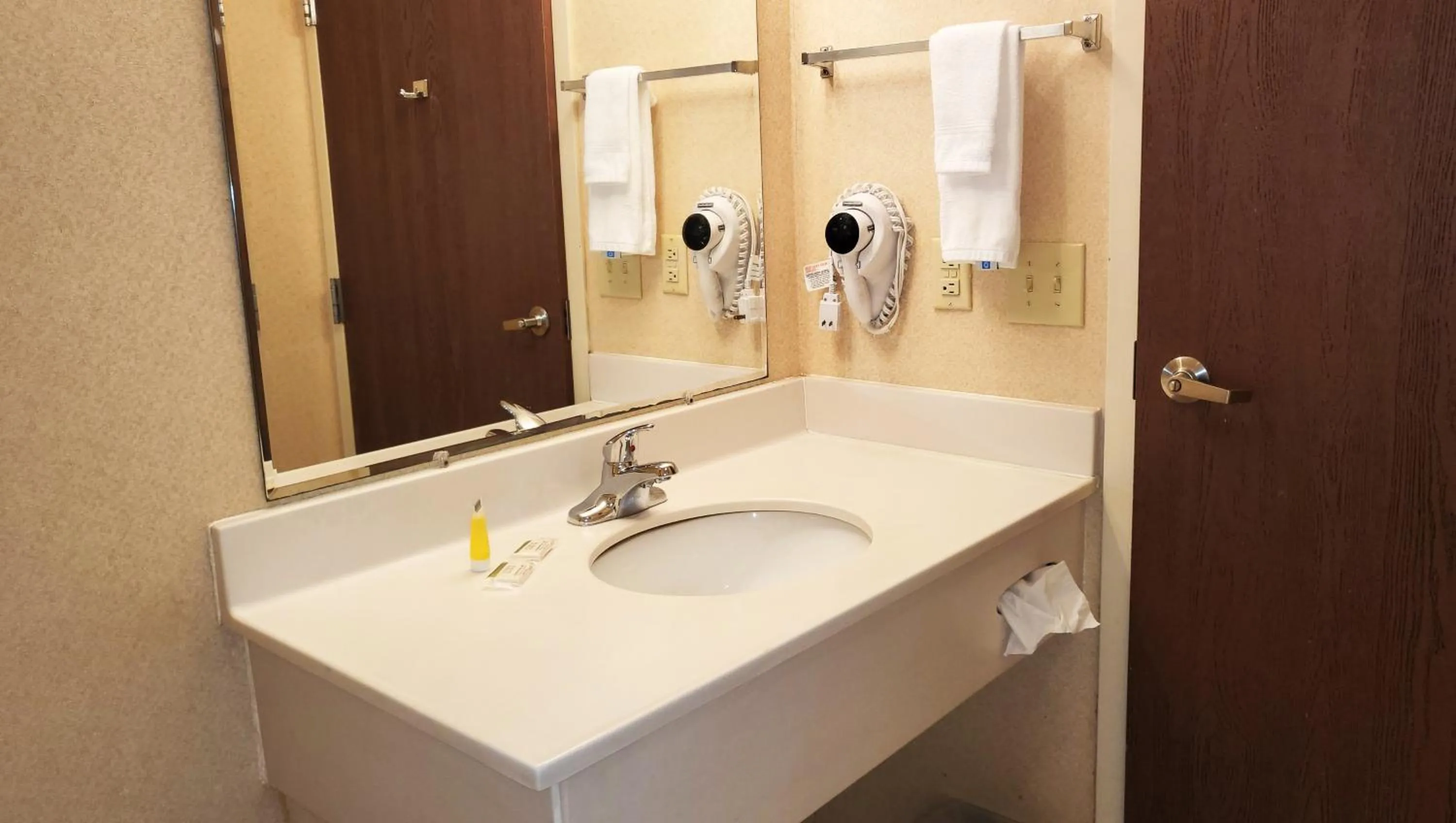 Bathroom in Magnuson Hotel West Liberty