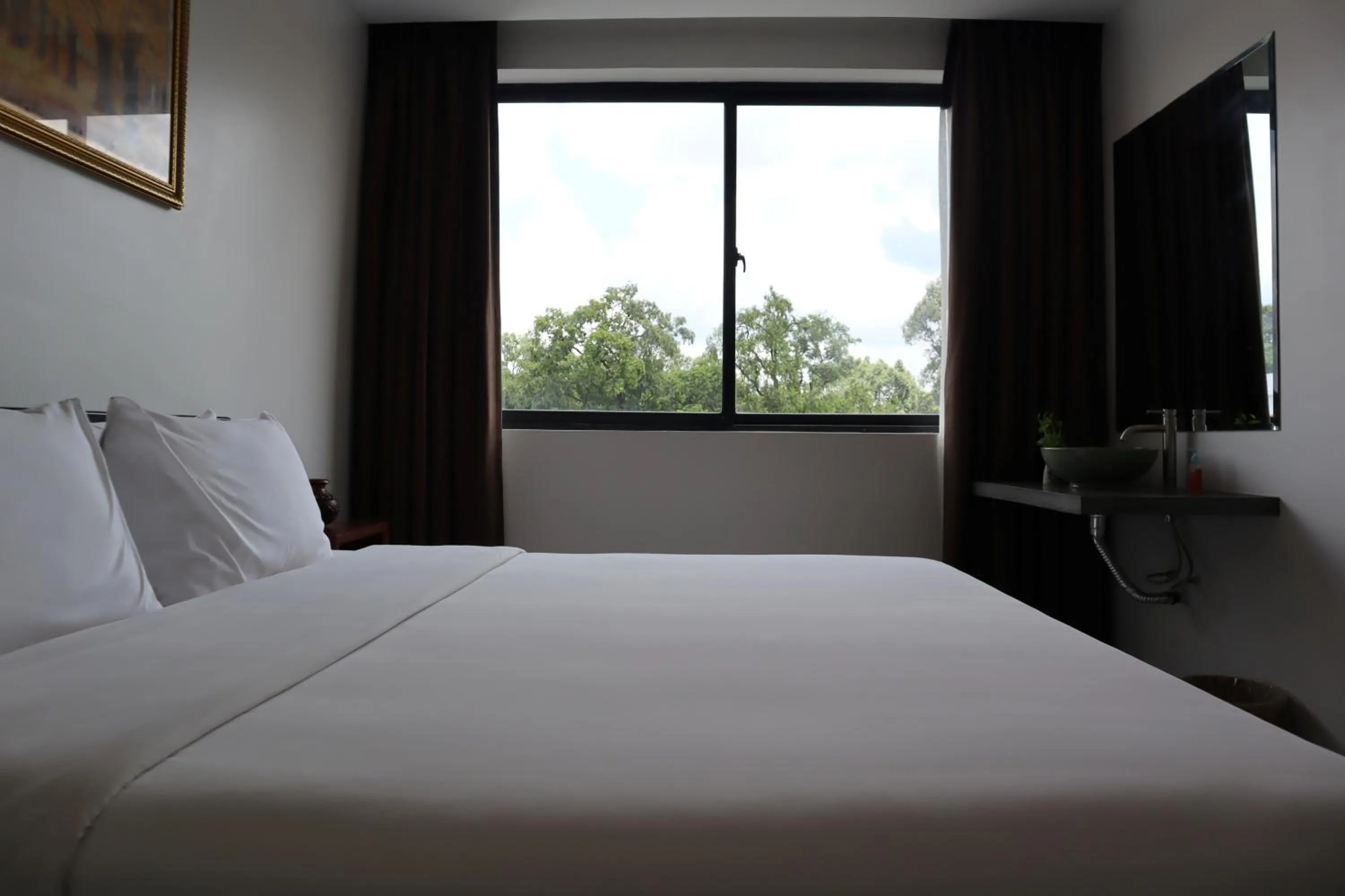Bed in Siem Reap Palace Hotel & Spa
