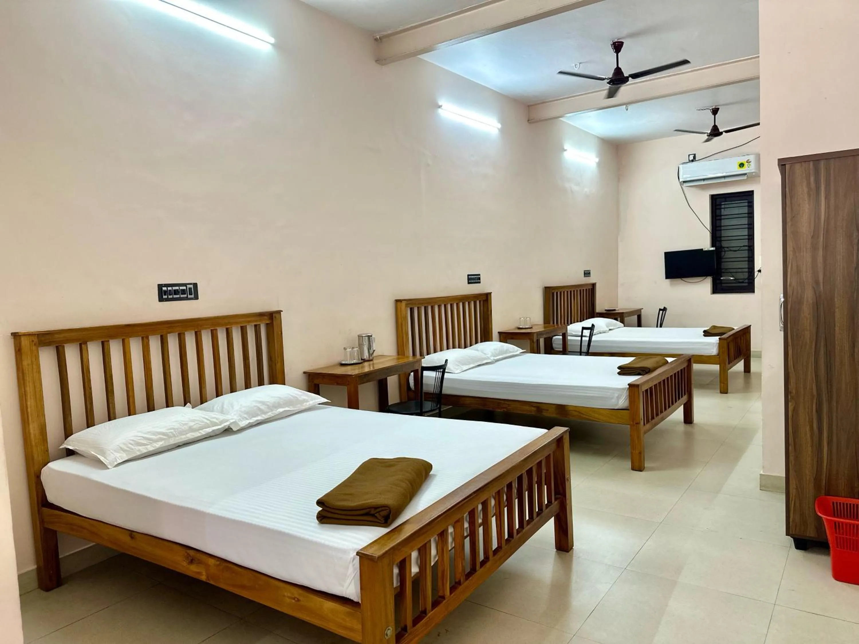 Bed in Sri Udupi Hotel