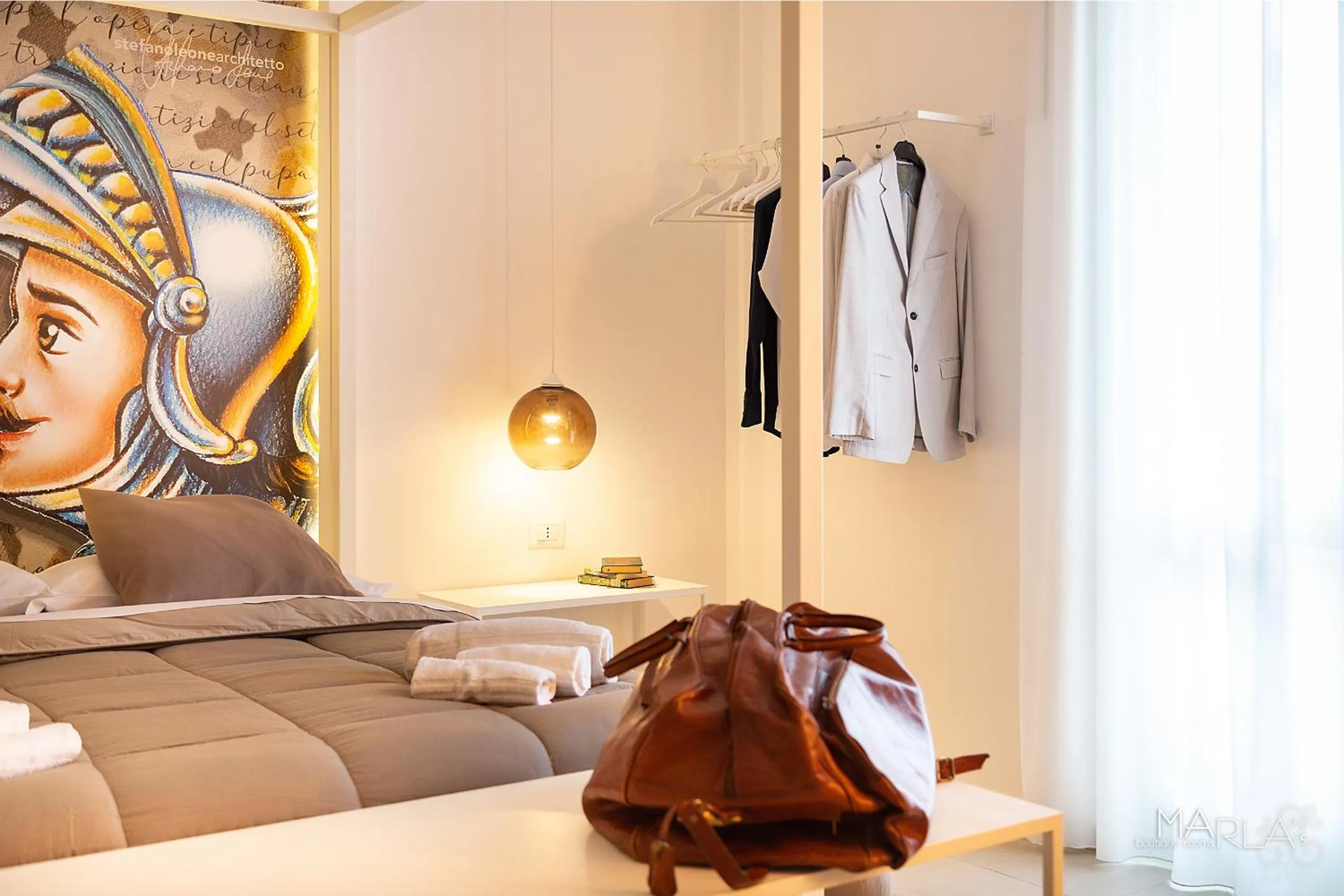 Photo of the whole room, Bed in Marla's boutique rooms