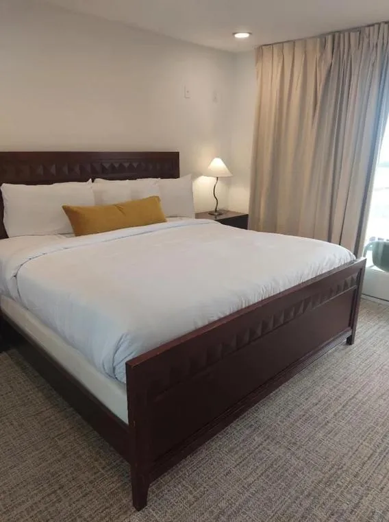 Bed in Coliseum Ocean Resort