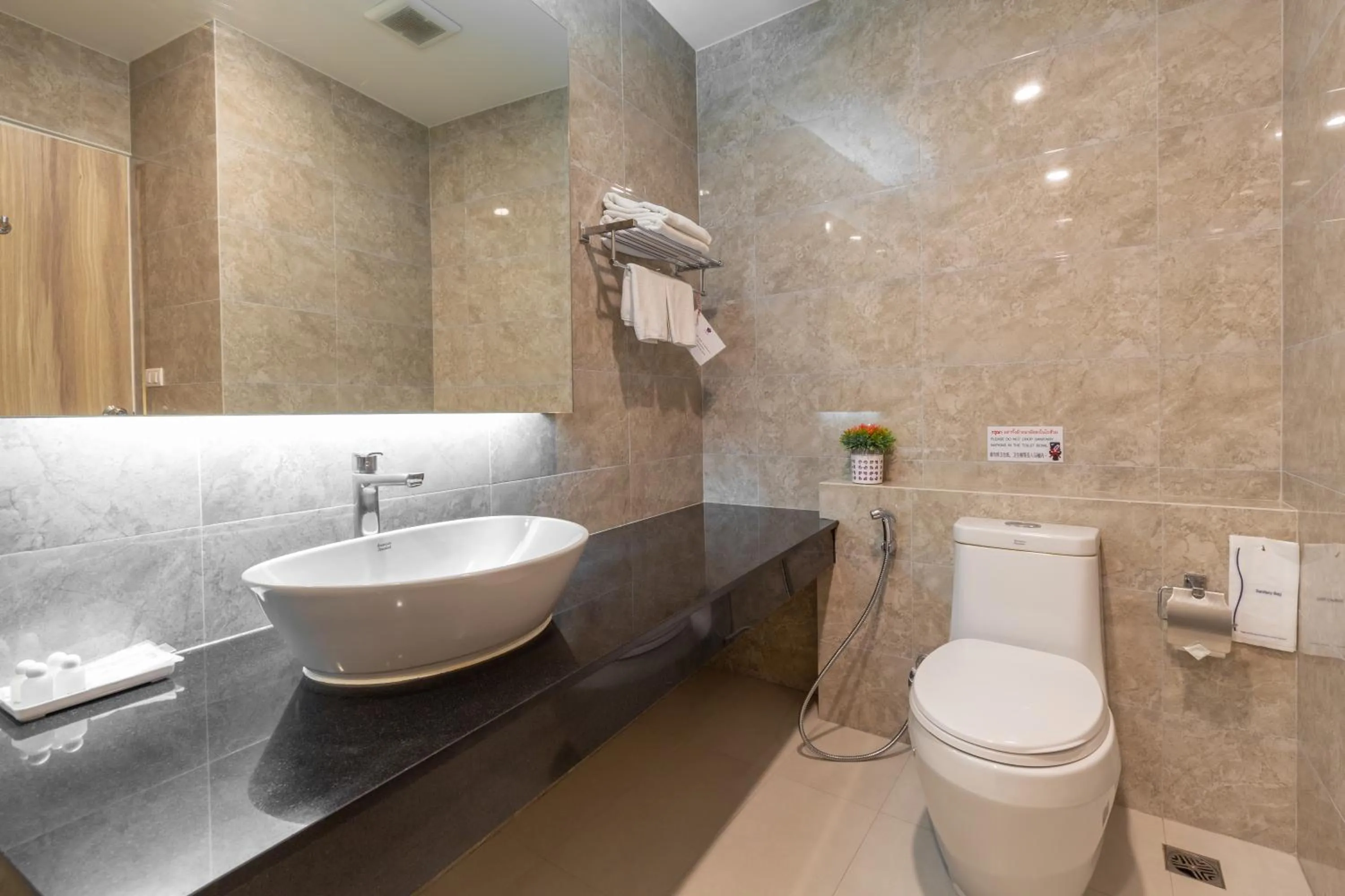 Bathroom in Leela Orchid Hotel