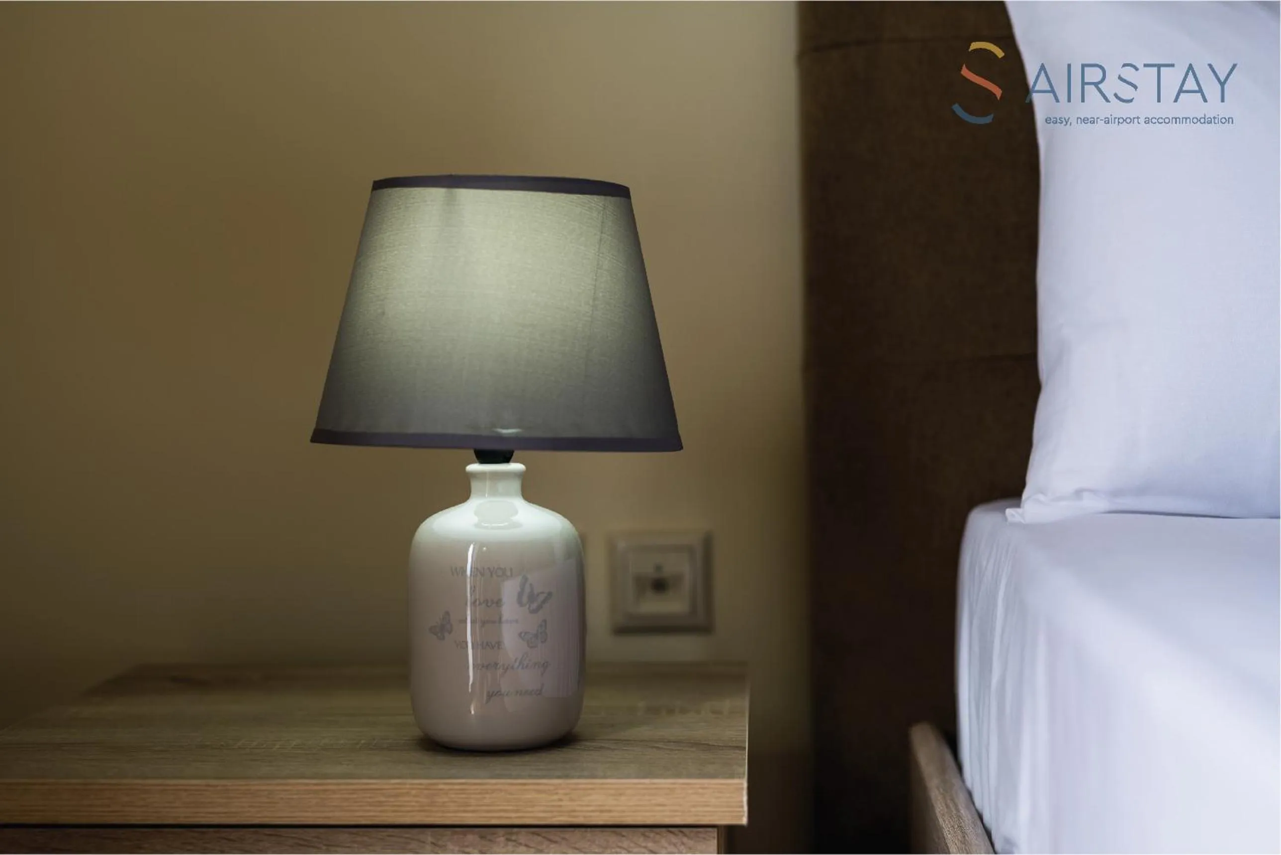 Decorative detail, Bed in Thresh Apartments Airport by Airstay