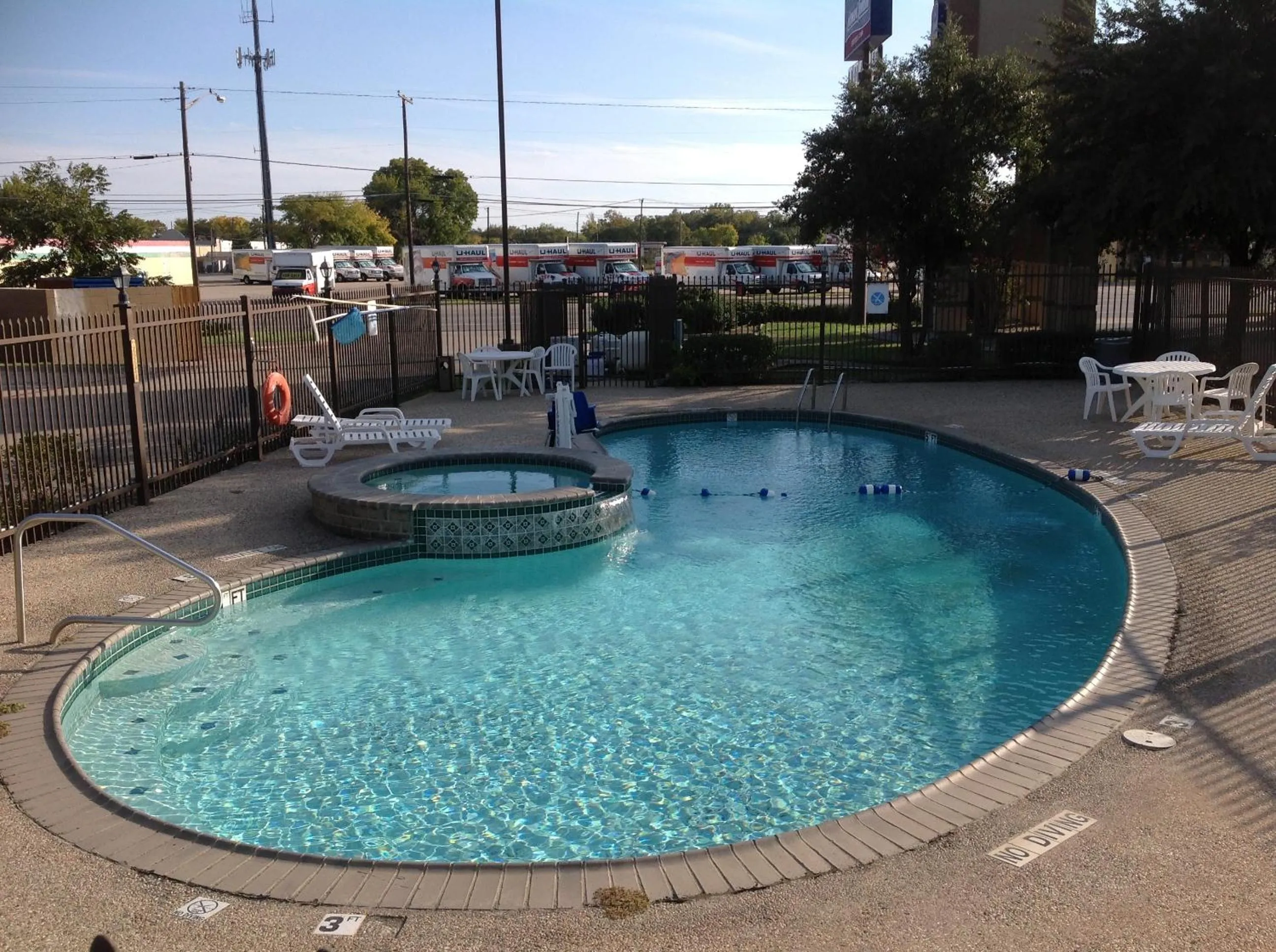 Swimming pool in Howard Johnson by Wyndham Grand Prairie Near Lone Star Park